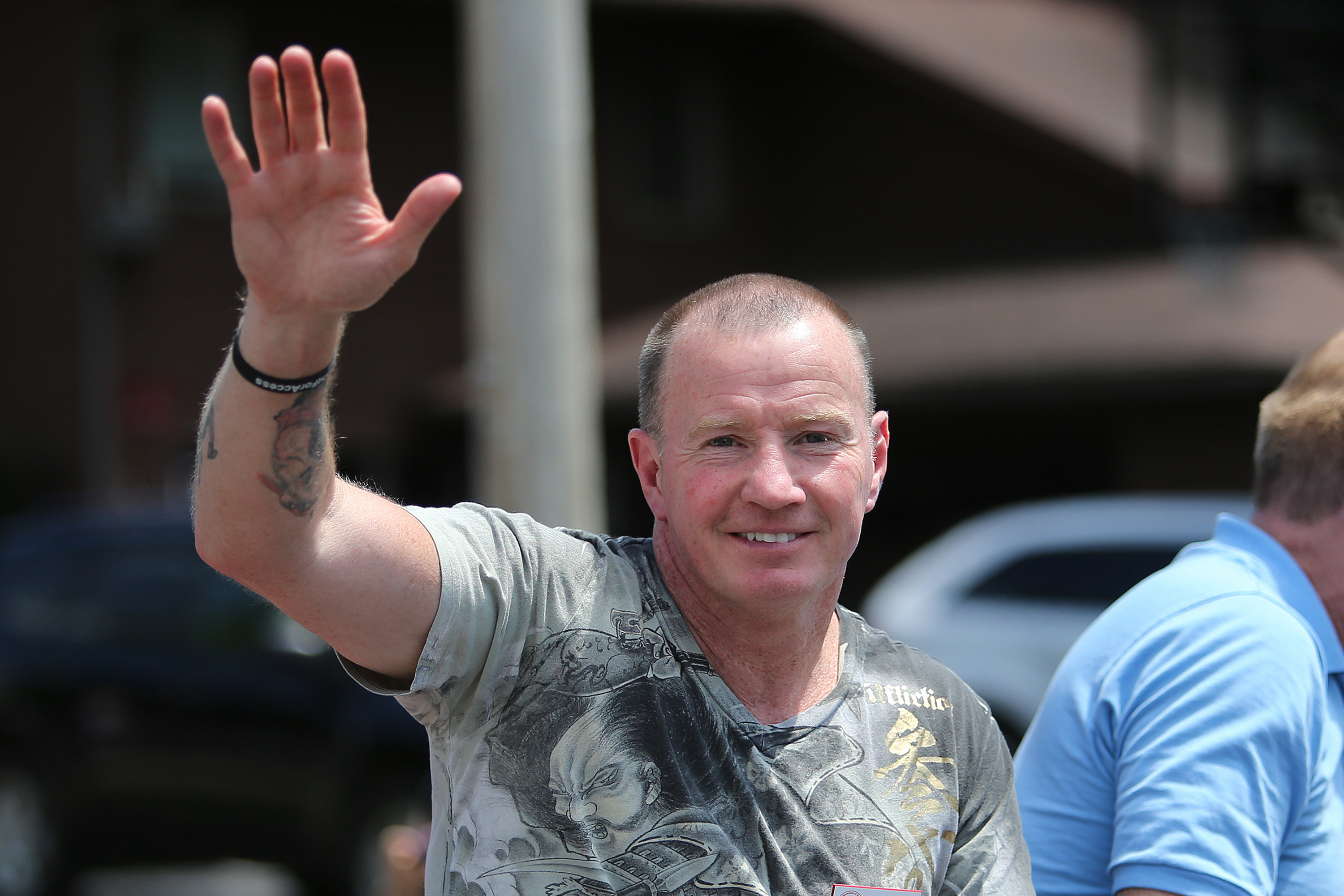 Micky Ward is pictured as he waves to fans during the parade at the International Boxing Hall of Fame induction Weekend of Champions events on June 14, 2015, in Canastota, New York | Source: Getty Images