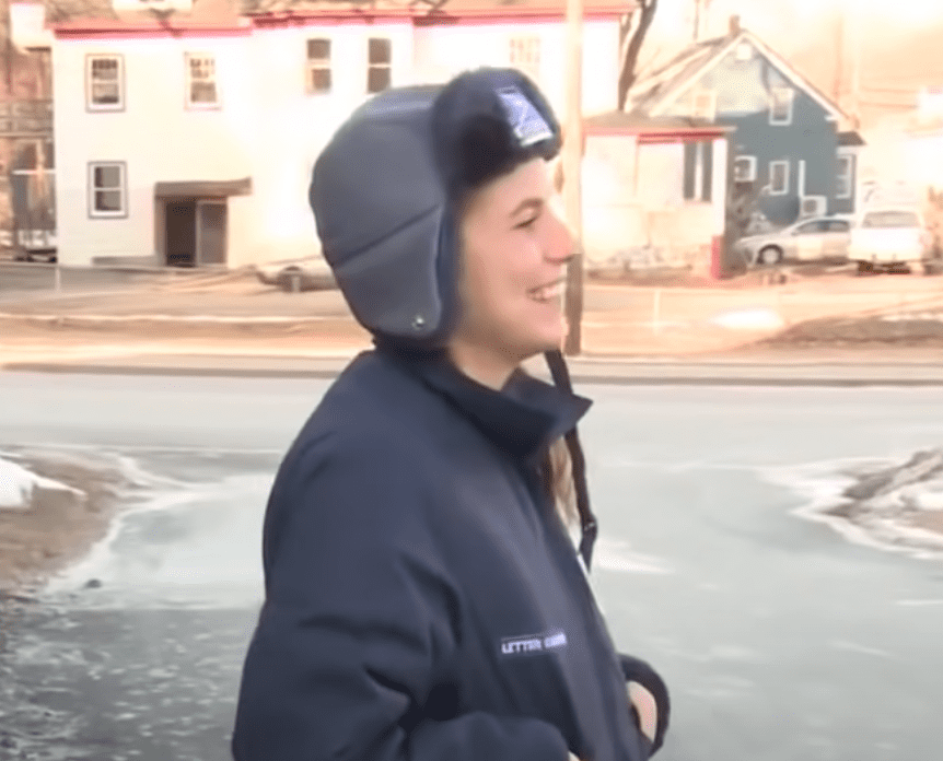 A delighted and relieved postal worker, Kayla Berridge. | Source: youtube.com/WCVB Channel 5 Boston