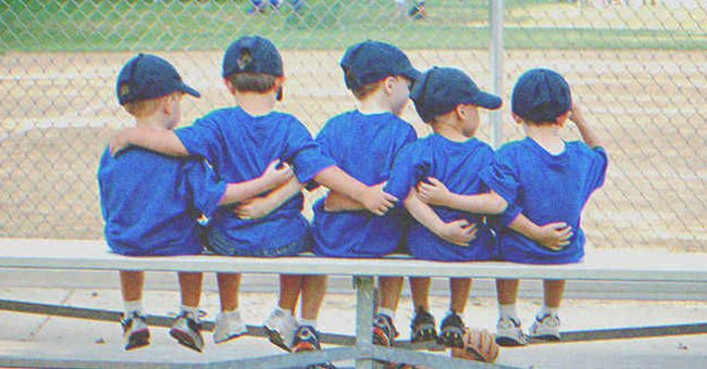Five kids sitting on a bench | Source: Shutterstock