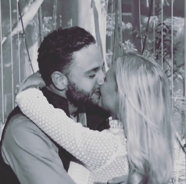 Posted on 14 February 2017, Adam and Caroline Thomas share an intimate kiss in this monochrome snap, capturing a romantic moment between the couple and offering a glimpse into the affection that has underpinned their long-standing relationship. | Source: Instagram/carolinethomas23