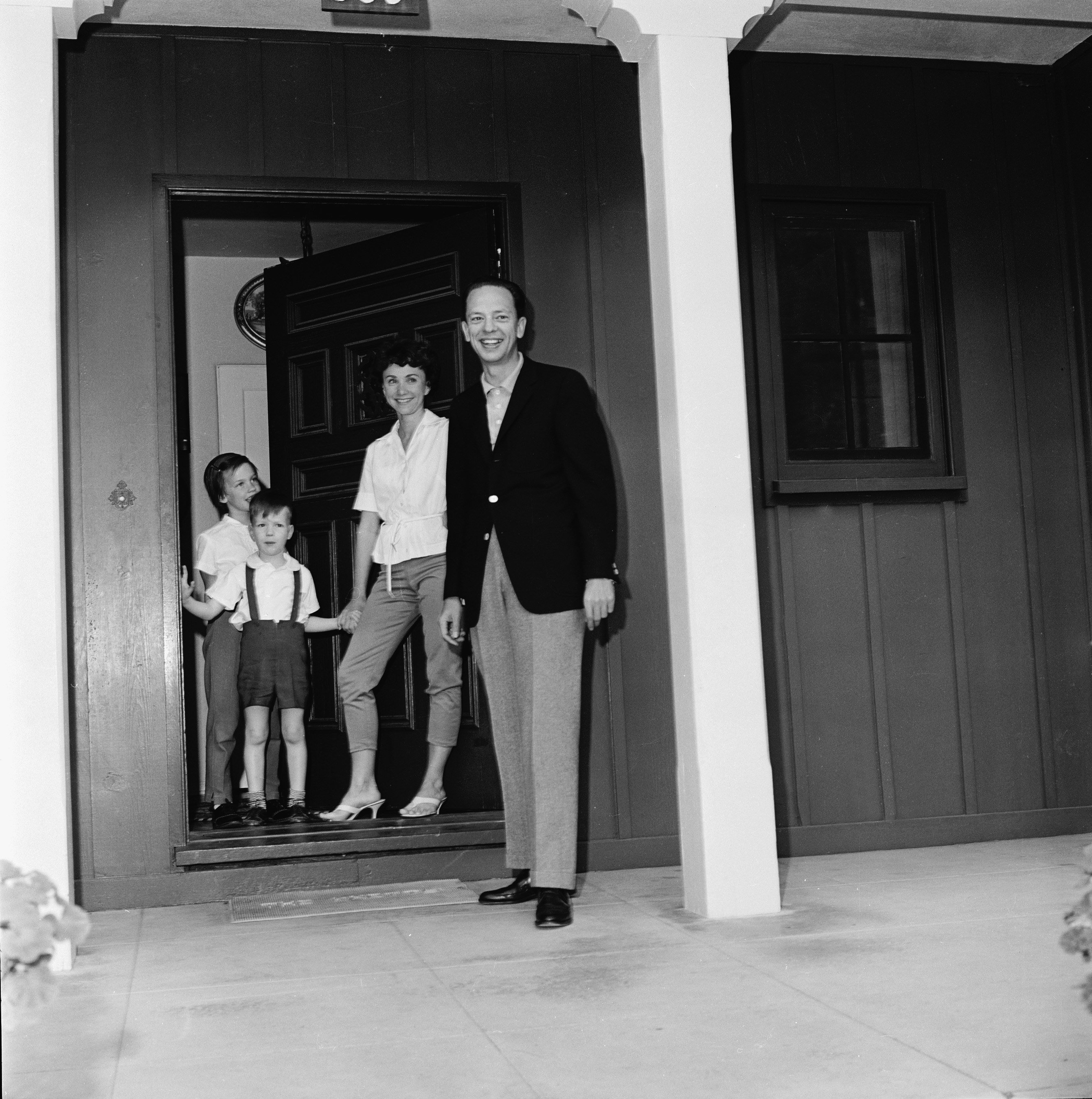 American television actor Don Knotts stands his family on the porch of their home, March 2, 1961. | Source: Getty Images