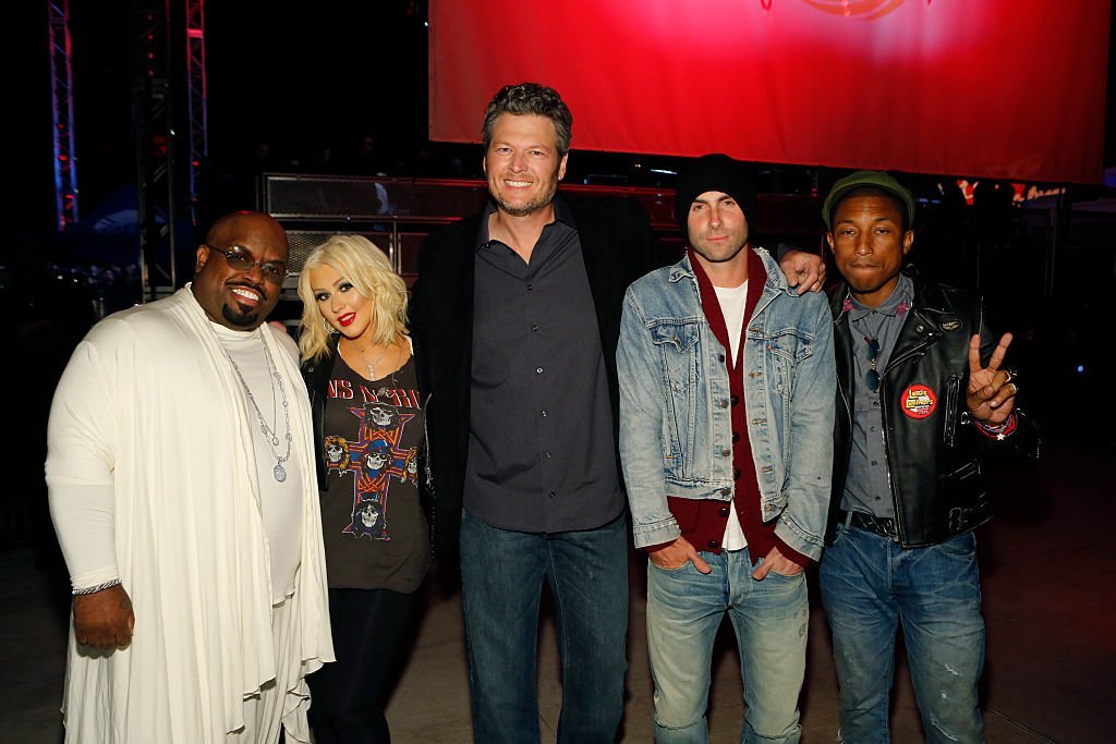 Former and current "The Voice" coaches CeeLo Green Christina Aguilera, Blake Shelton, Adam Levine and Pharrell William pose at a concert in West Hollywood, California on April 23, 2015 | Photo: Getty Images