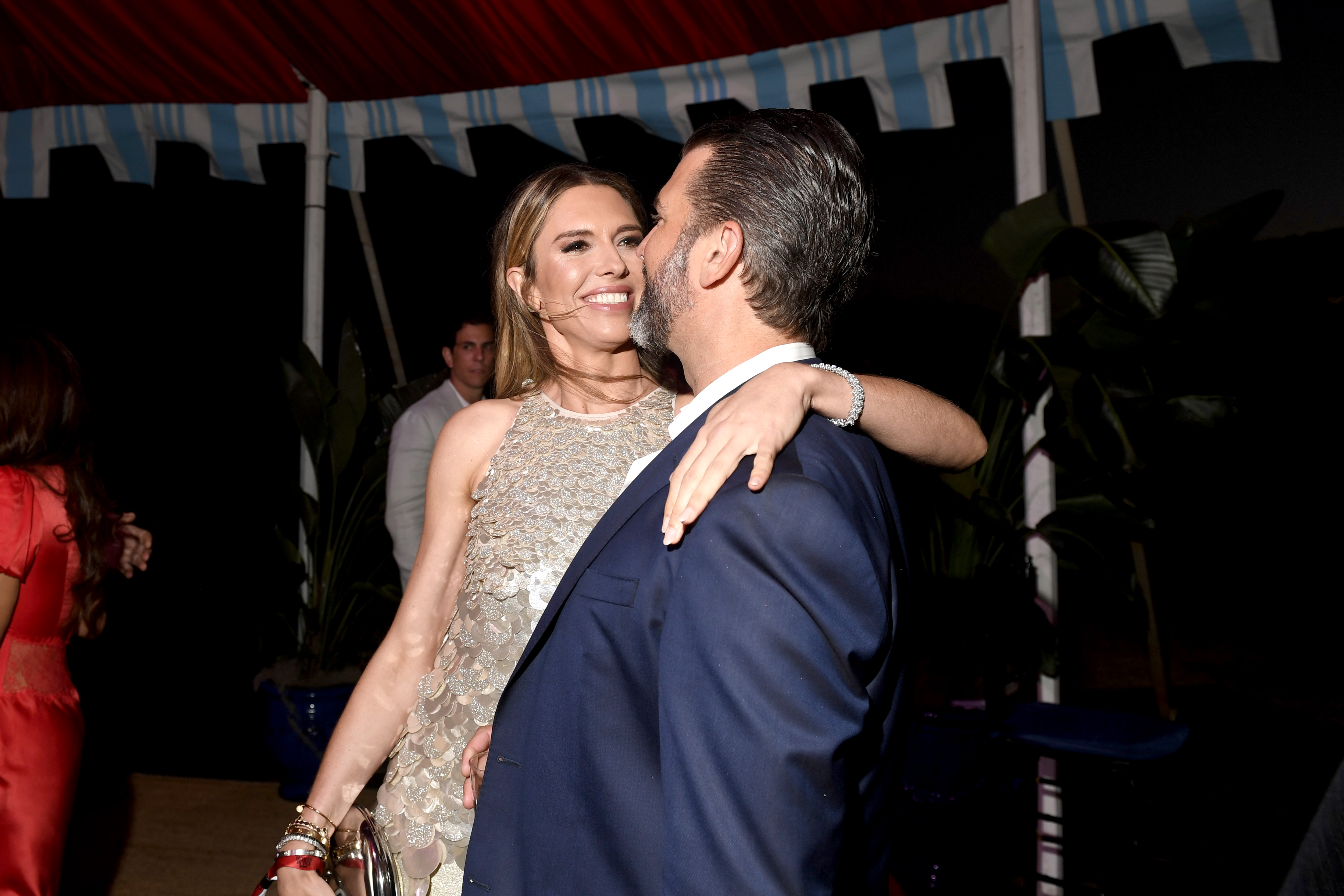 Bettina Anderson embraces Donald Trump Jr. during the amfAR Palm Beach Gala on March 15, 2025. | Source: Getty Images