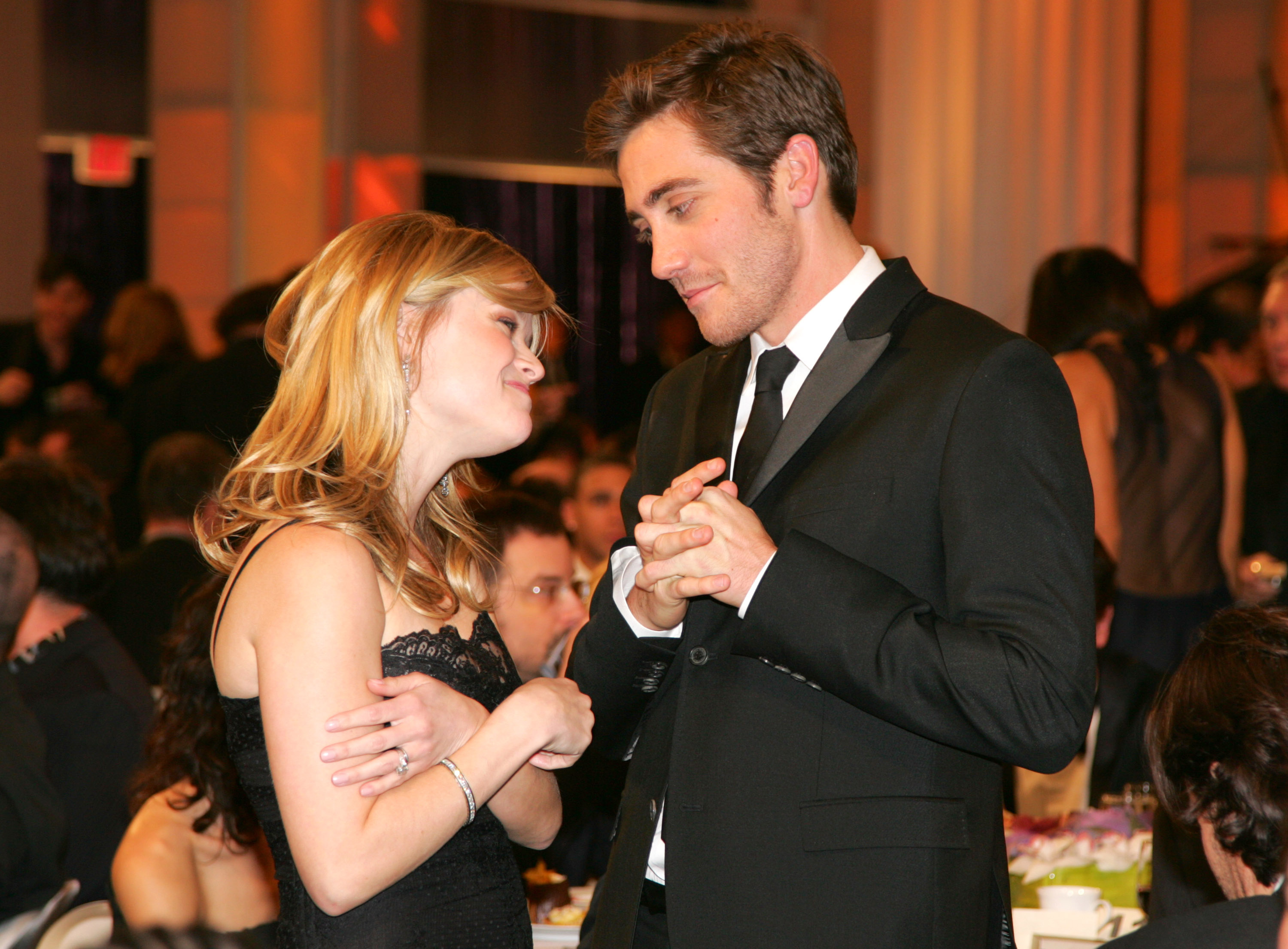 Witherspoon and Jake Gyllenhaal share a moment at the 11th Annual Critics' Choice Awards in 2006. As they engage in conversation, Gyllenhaal looks at her sweetly, while Witherspoon appears slightly shy in his presence.