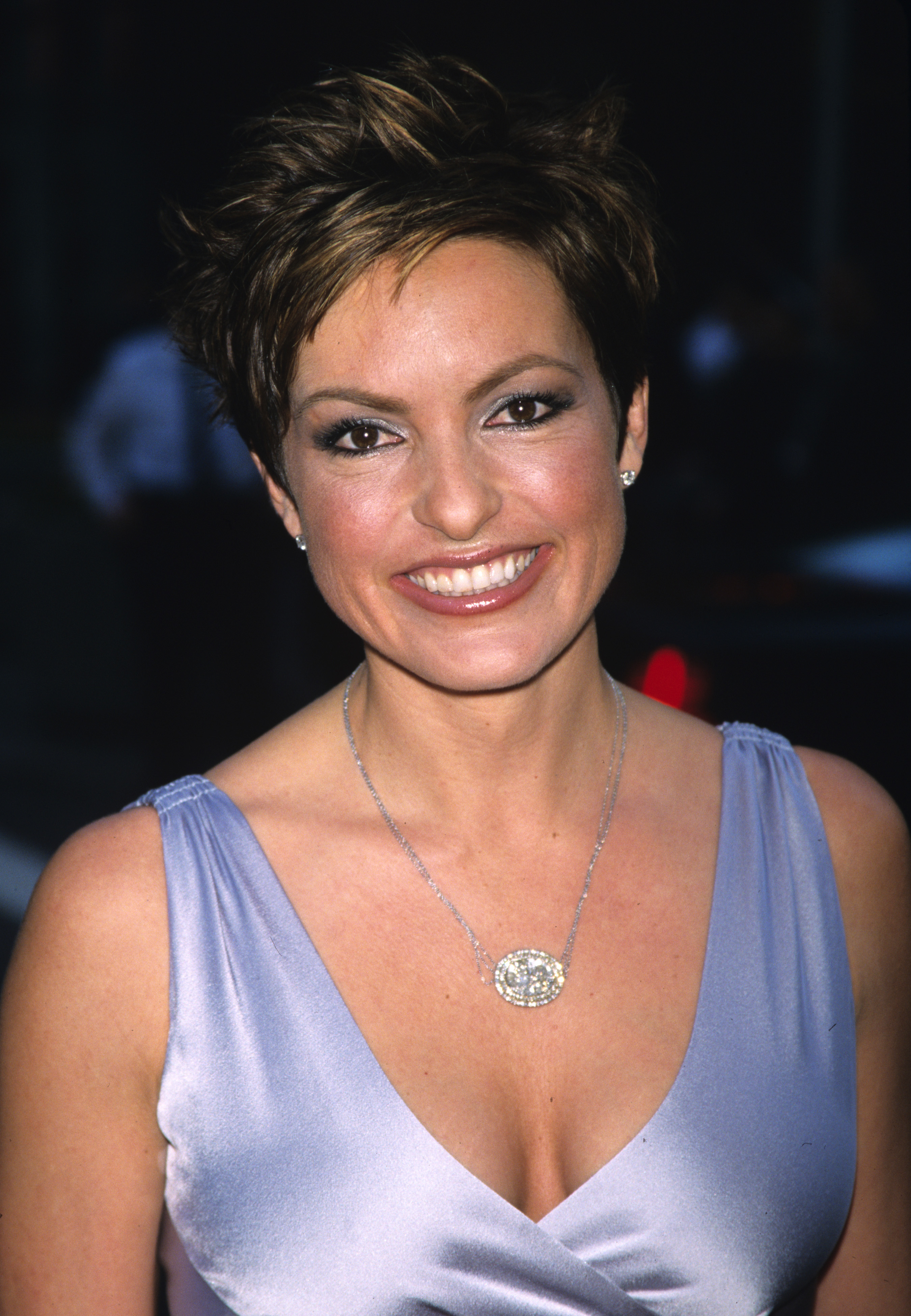 The pixie is even more cropped and textured here, with bold golden-brown highlights spiked through the top — Hargitay glows at NBC's 75th anniversary celebration in a powder-blue satin gown.