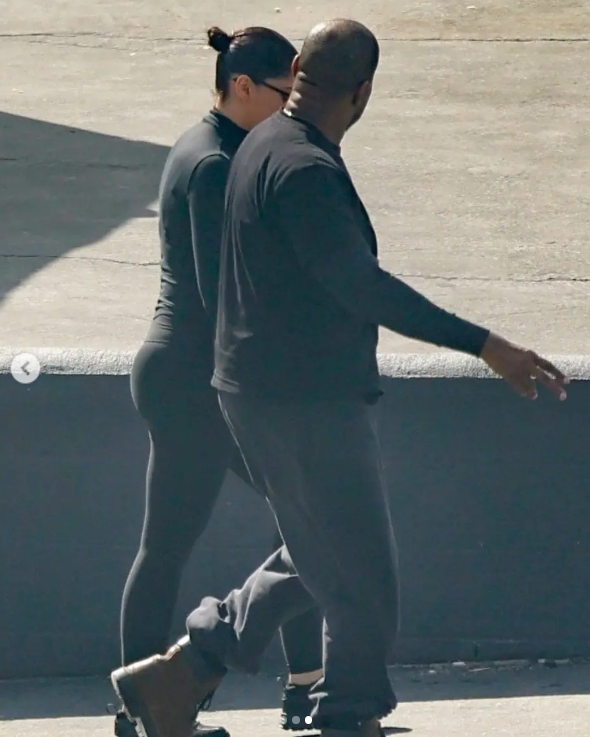 Kanye West walking and talking to an unidentified woman | Source: Instagram/pagesix