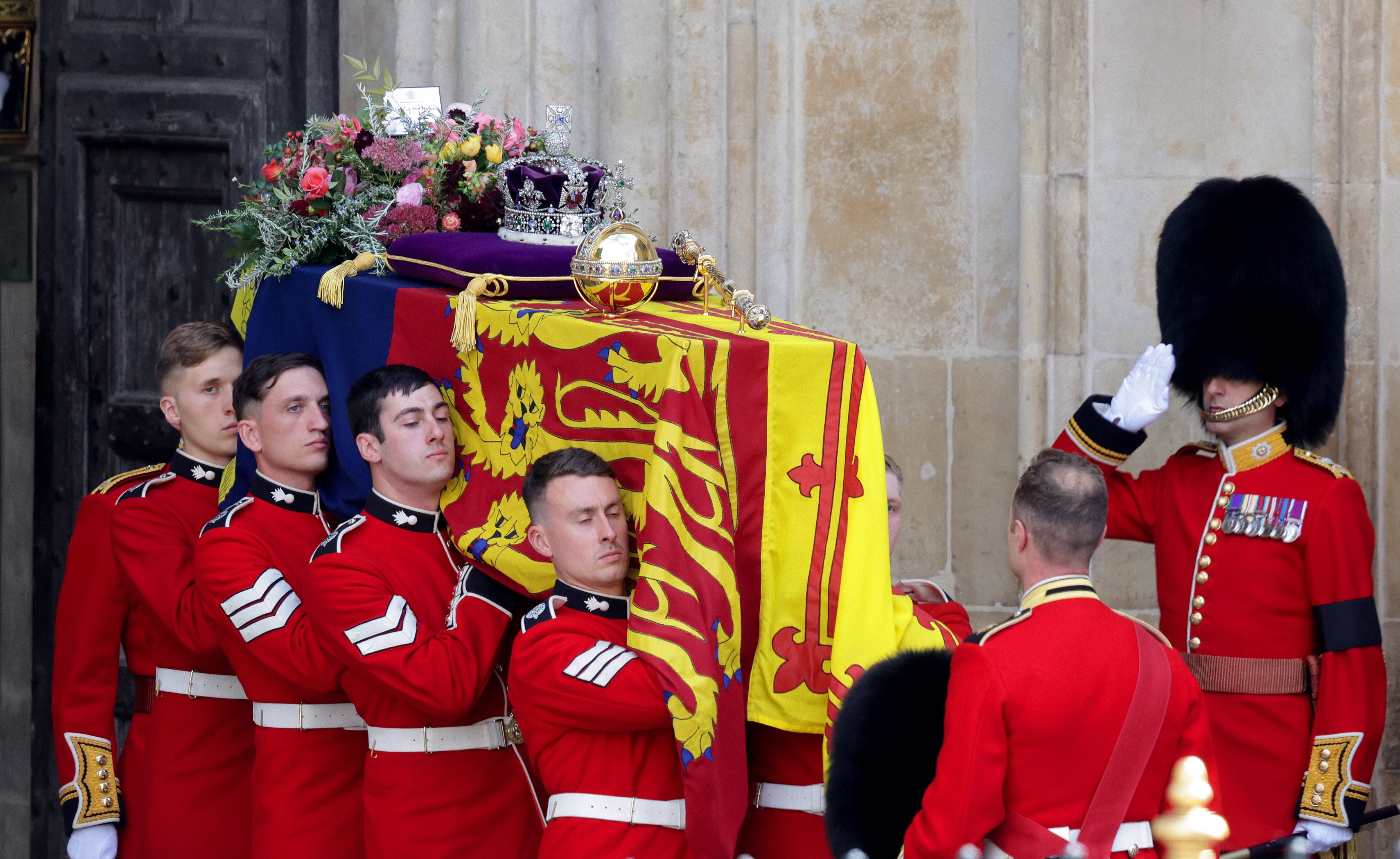 The coffin of Queen Elizabeth II with the Imperial State Crown resting on top is carried by the Bearer Party as it departs Westminster Abbey during the State Funeral on September 19, 2022 in London, England. | Source: Getty Images