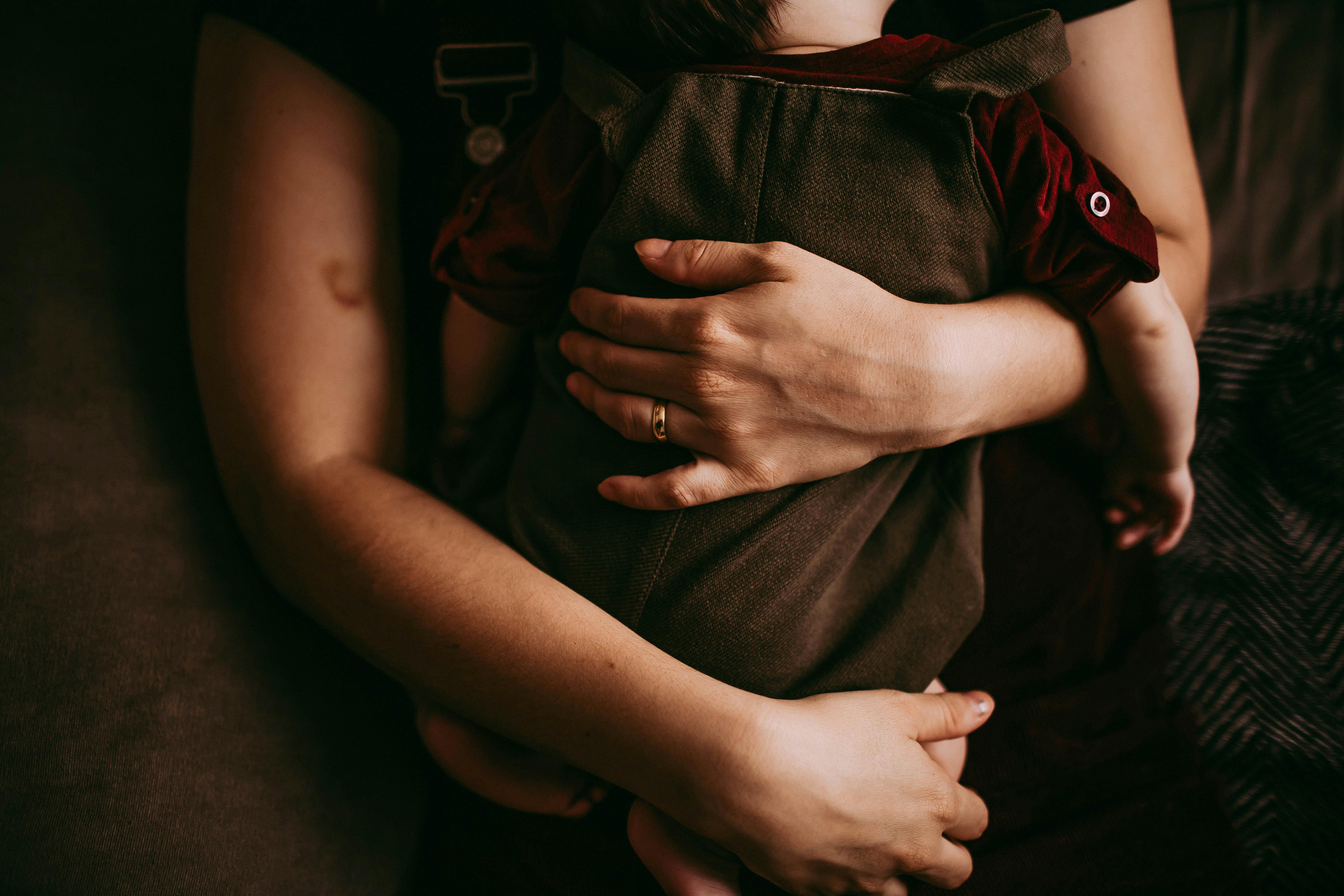 A person hugging their child | Source: Pexels