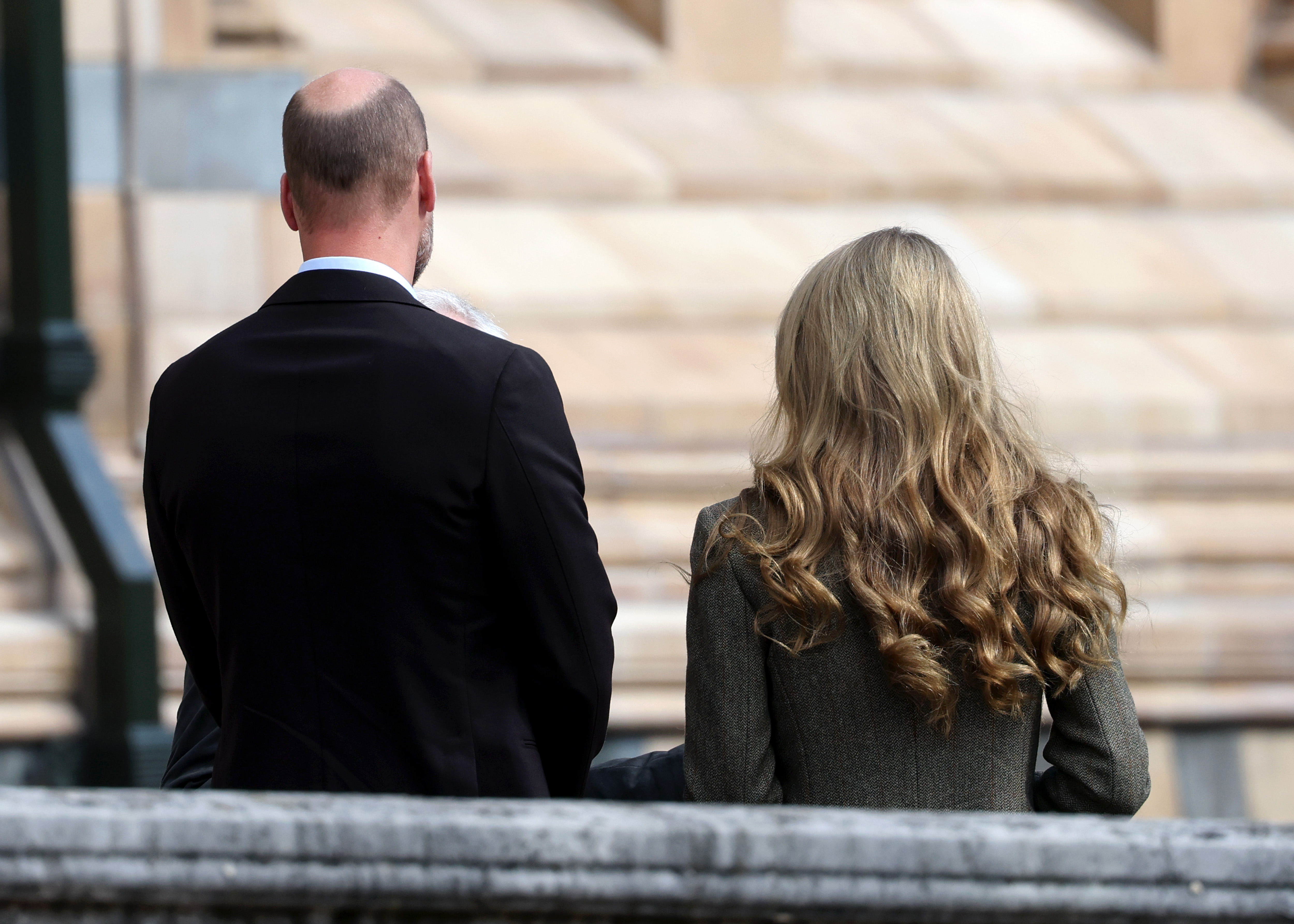 Seen from behind with Prince William, Princess Catherine's golden locks flow in gentle waves. The couple toured the museum's gardens, which reopened in 2024 as a space to explore and conserve urban biodiversity.