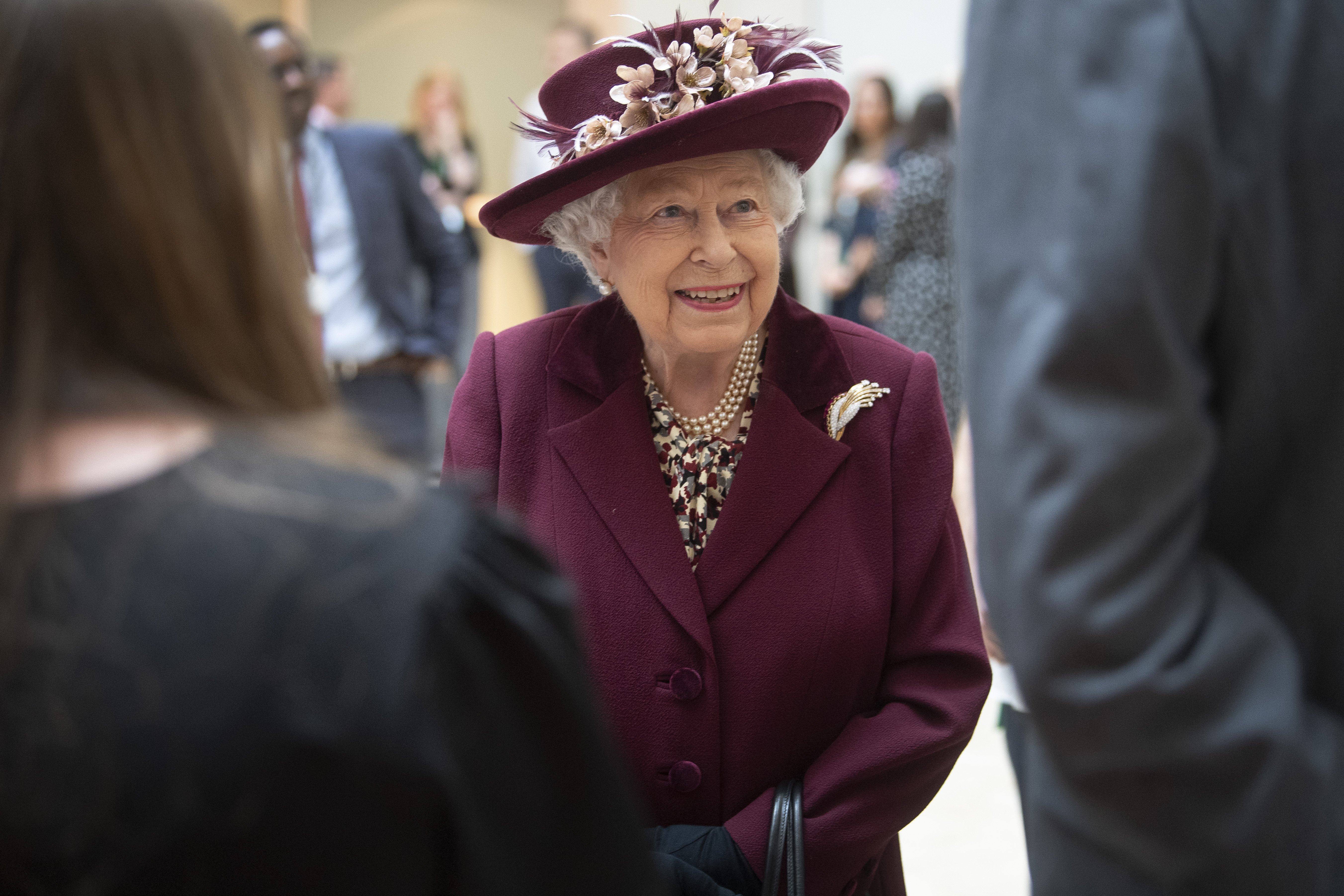 Queen Elizabeth II talks with MI5 officers during a visit to the headquarters of MI5 at Thames House on February 25, 2020, in London, England. | Source: Getty Images.