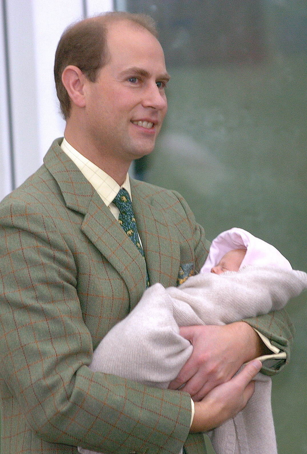 On November 23, 2003, Prince Edward held newborn Lady Louise outside Frimley Park Hospital in England. Despite her premature birth and early health challenges, she was warmly welcomed by her family and later cherished for her resilient spirit. | Source: Getty Images