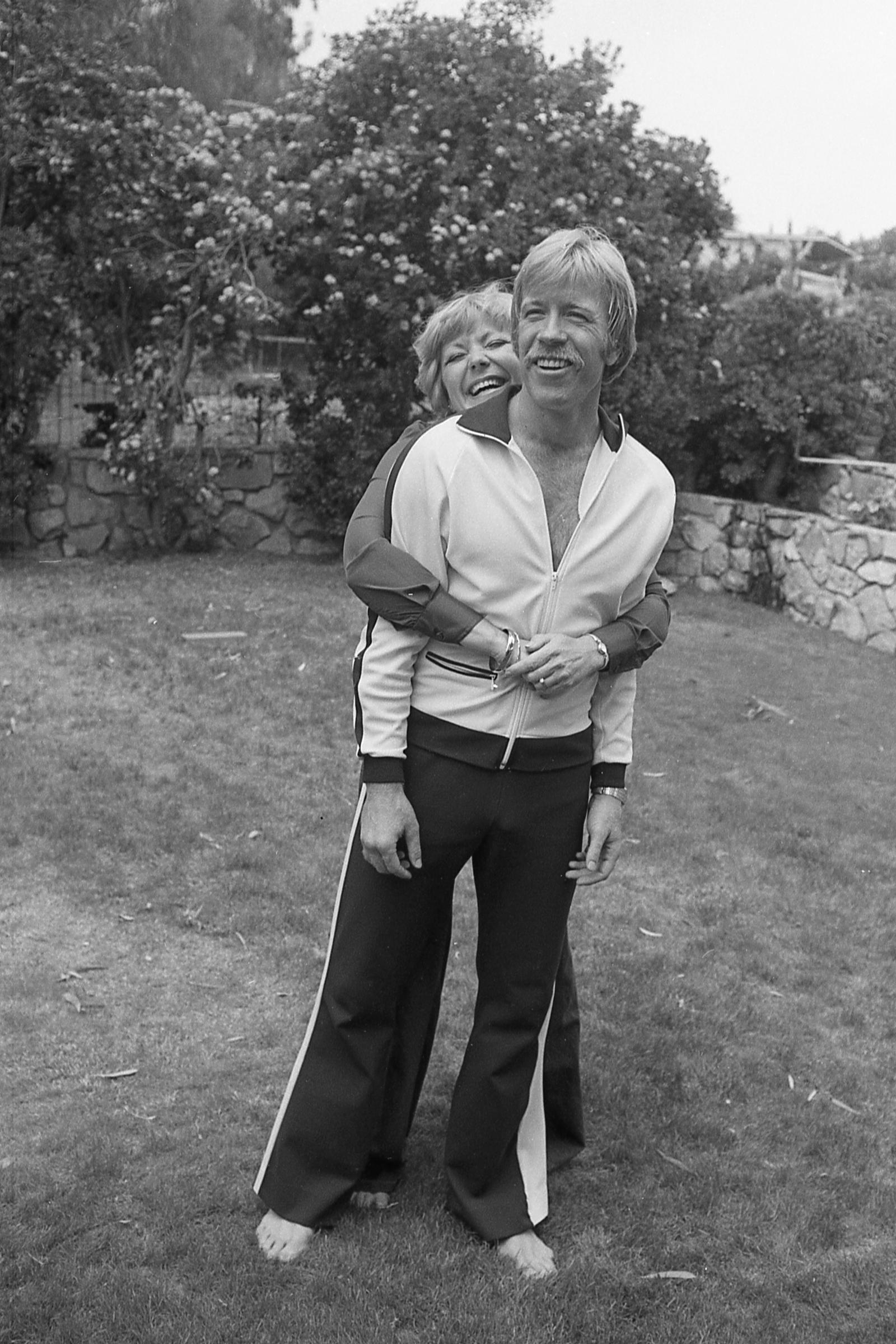 Chuck Norris poses in the garden of his Palos Verdes, California home with his wife, Dianne Holechek. | Source: Getty Images