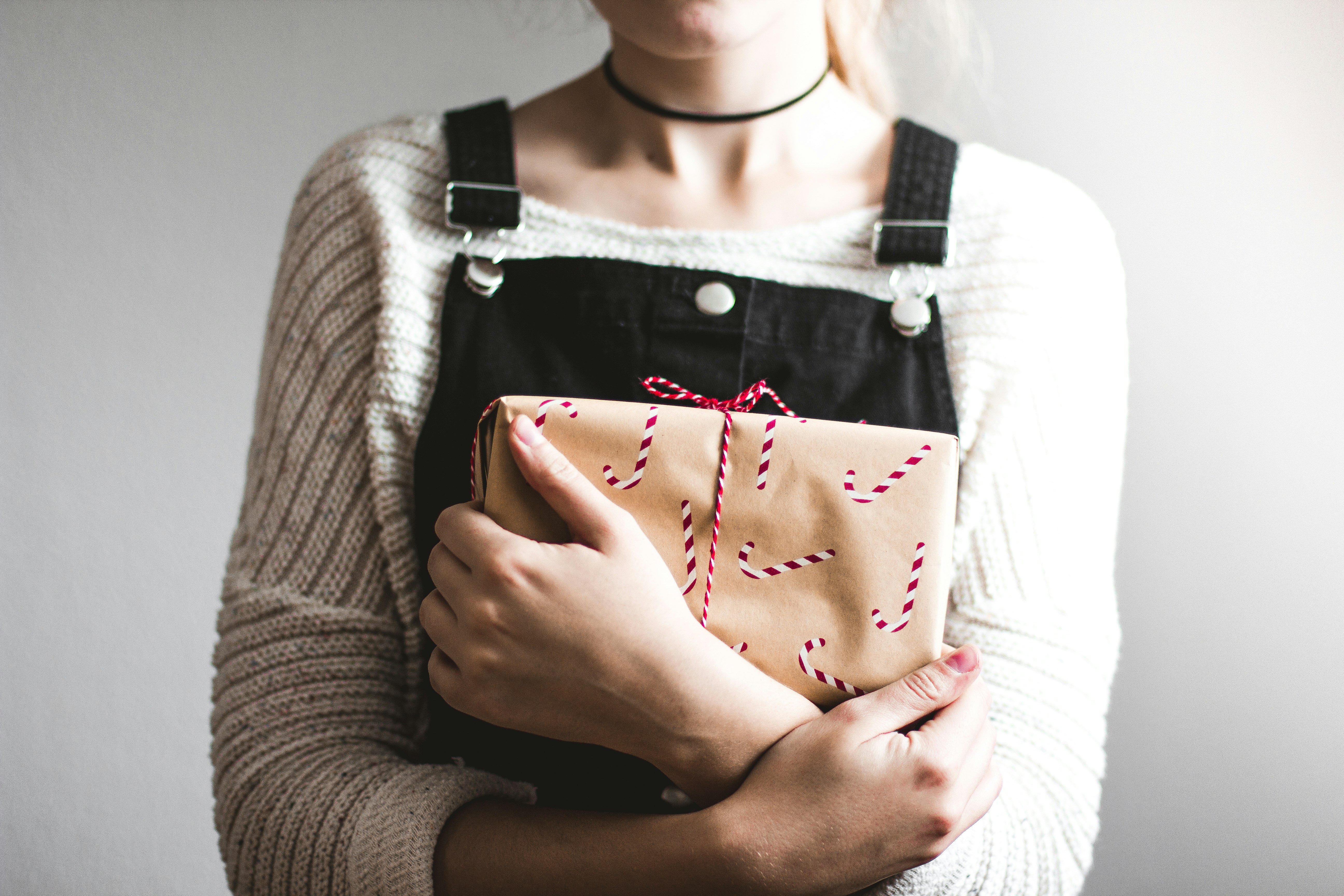 A woman holding a parcel | Source: Unsplash