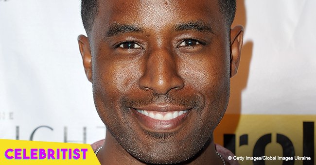 Gavin Houston kisses a curvaceous woman by the sea after revealing he has a girlfriend