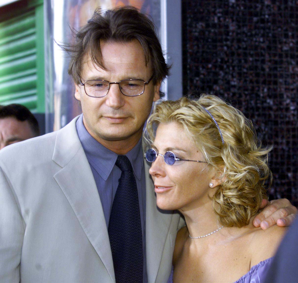 Liam Neeson stands with his arm around Natasha Richardson at the Dublin premiere of Star Wars: Episode I – The Phantom Menace on July 15, 1999. The pair face photographers as they arrive for the screening of the film.