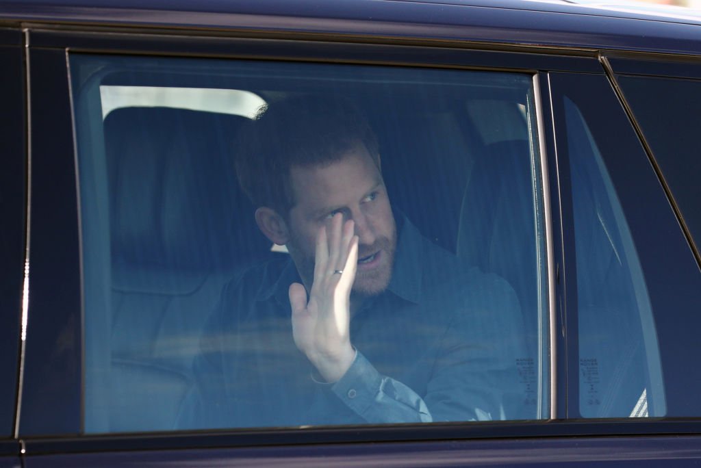 Prince Harry waves from his vehicle as he left the Silverstone Experience at Silverstone on March 6, 2020, in Northampton, England | Source: Simon Dawson-WPA Pool/Getty Images