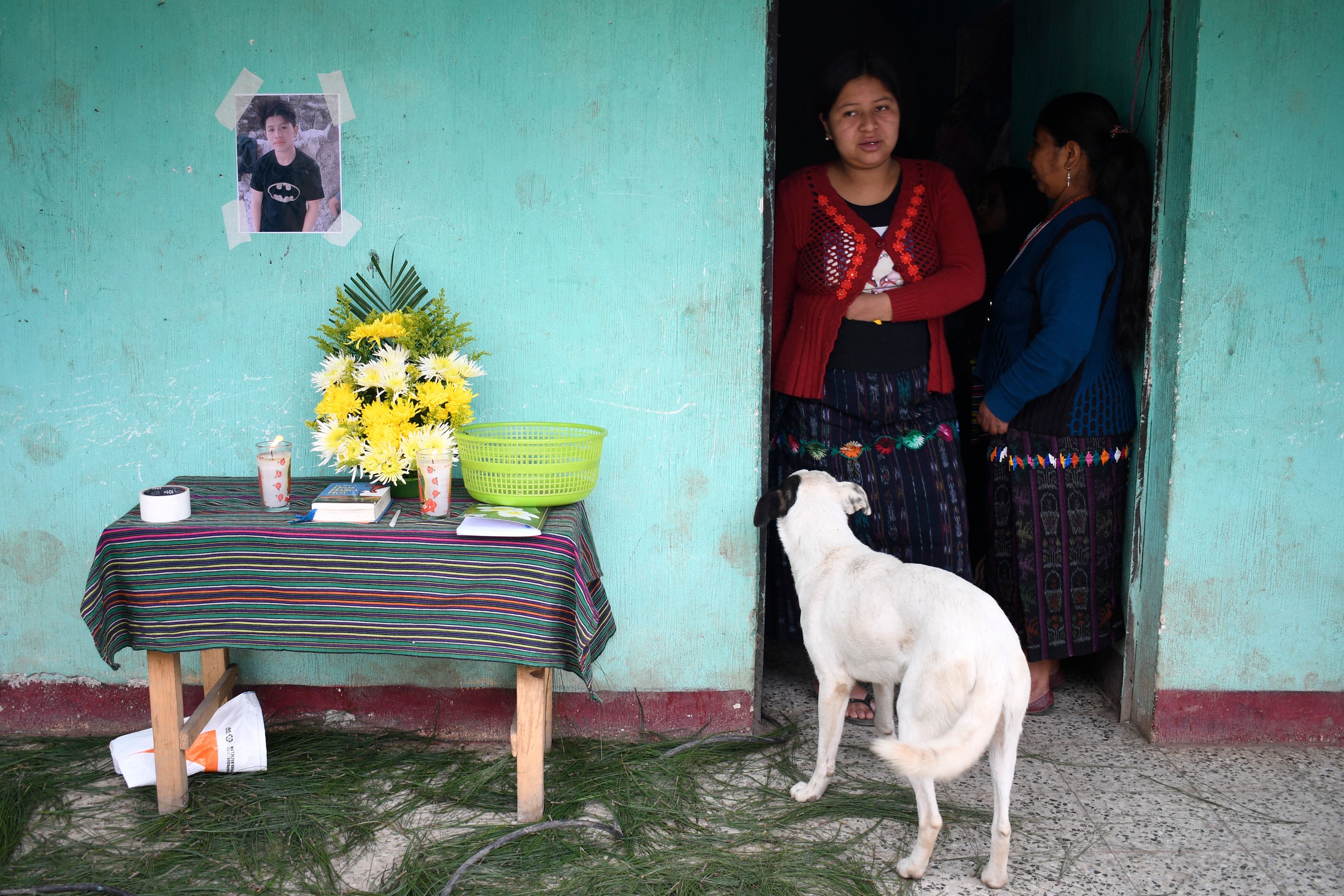 Juan Wilmer Tepaz's family standing by his memorial set up in 2022. | Source: Getty Images