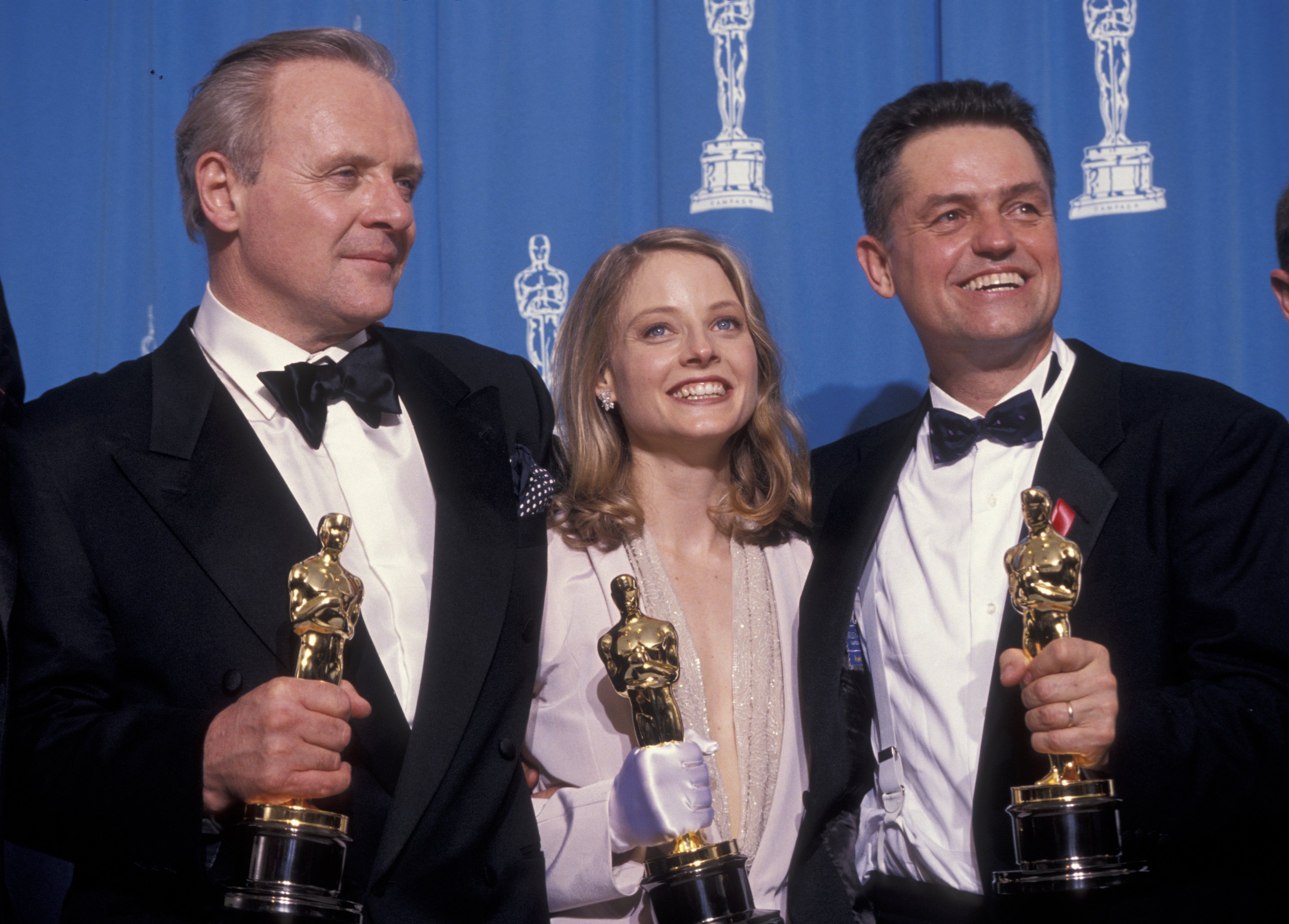 Anthony Hopkins, Jodie Foster, and Jonathan Demme at the 64th Annual Academy Awards in 1992, in Hollywood. | Source: Getty Images