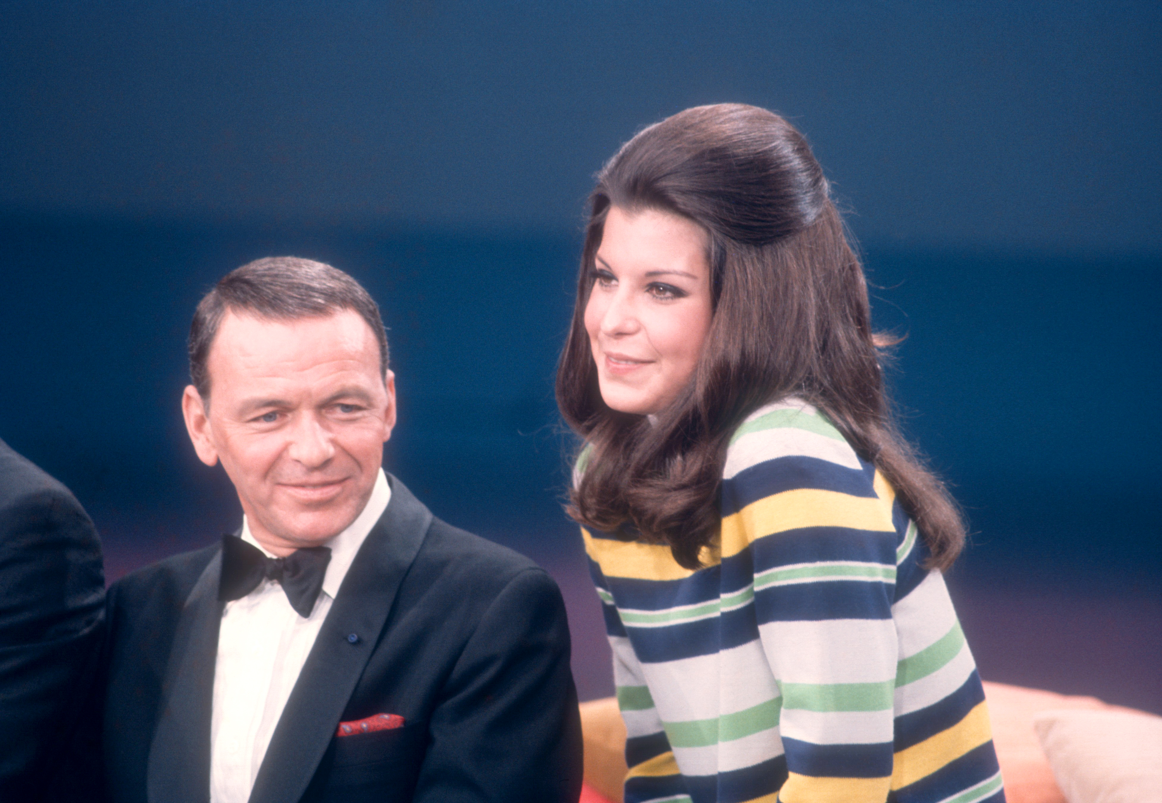 Frank Sinatra and his daughter Tina Sinatra sing during the taping of "The Dean Martin Variety Show" in Hollywood, California, circa 1967 | Source: Getty Images
