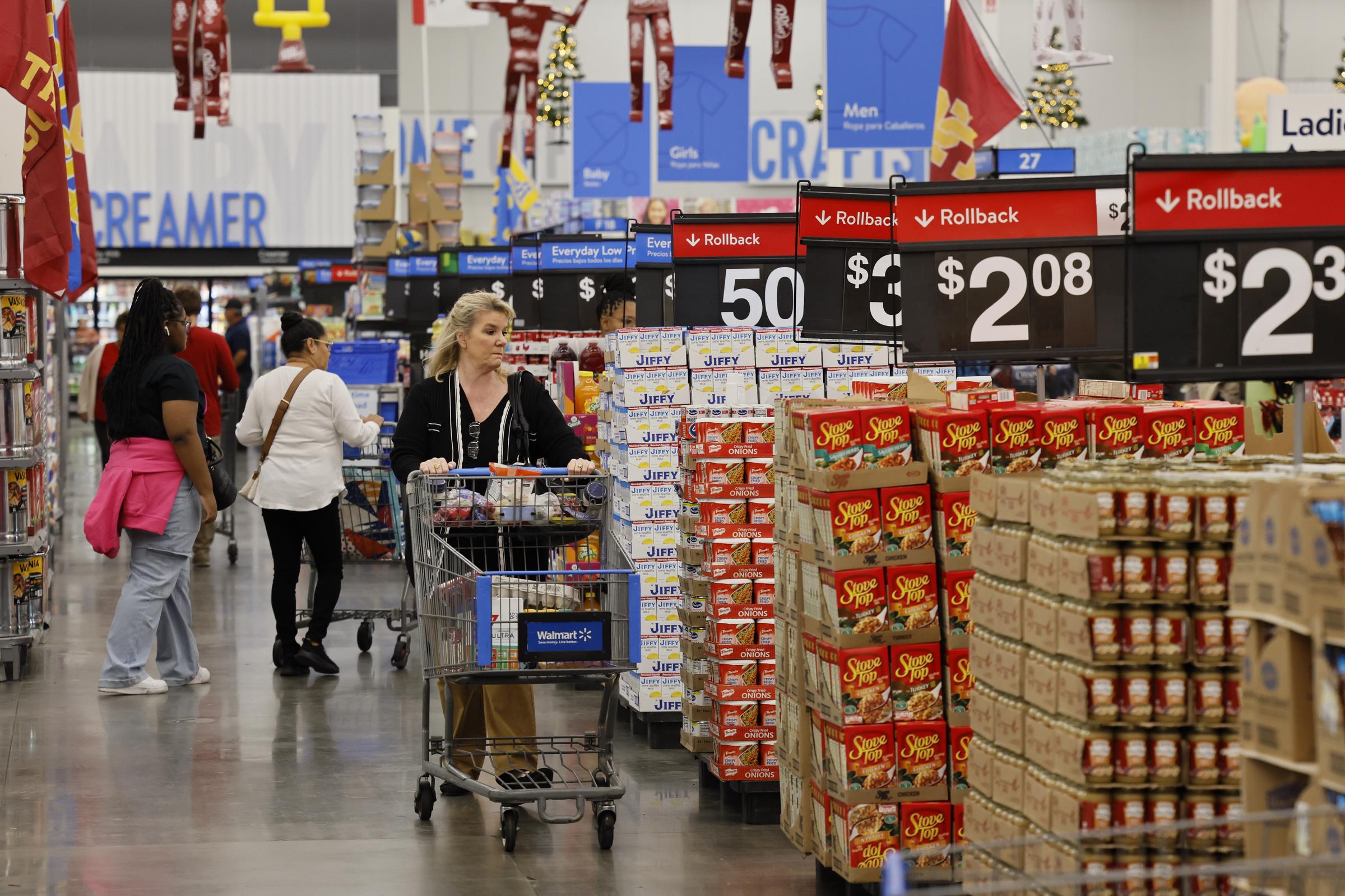 Shoppers looking for products inside Walmart | Source: Getty Images