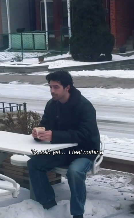 Joe Jonas sitting alone with a coffee in hand | Source: TikTok.com/@joejonas