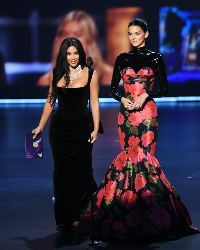 Kim Kardashian West and Kendall Jenner onstage during the 71st Emmy Awards. | Source: Getty Images