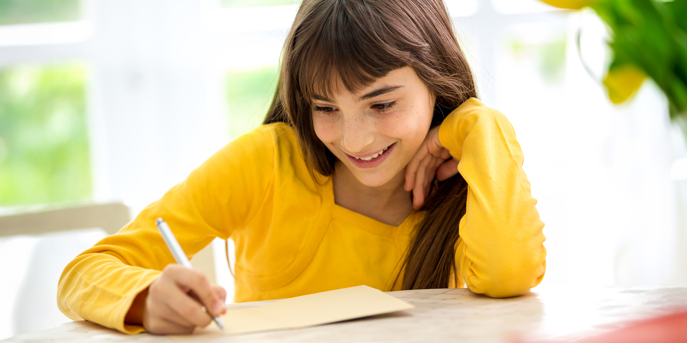 A child writing a letter | Source: Shutterstock
