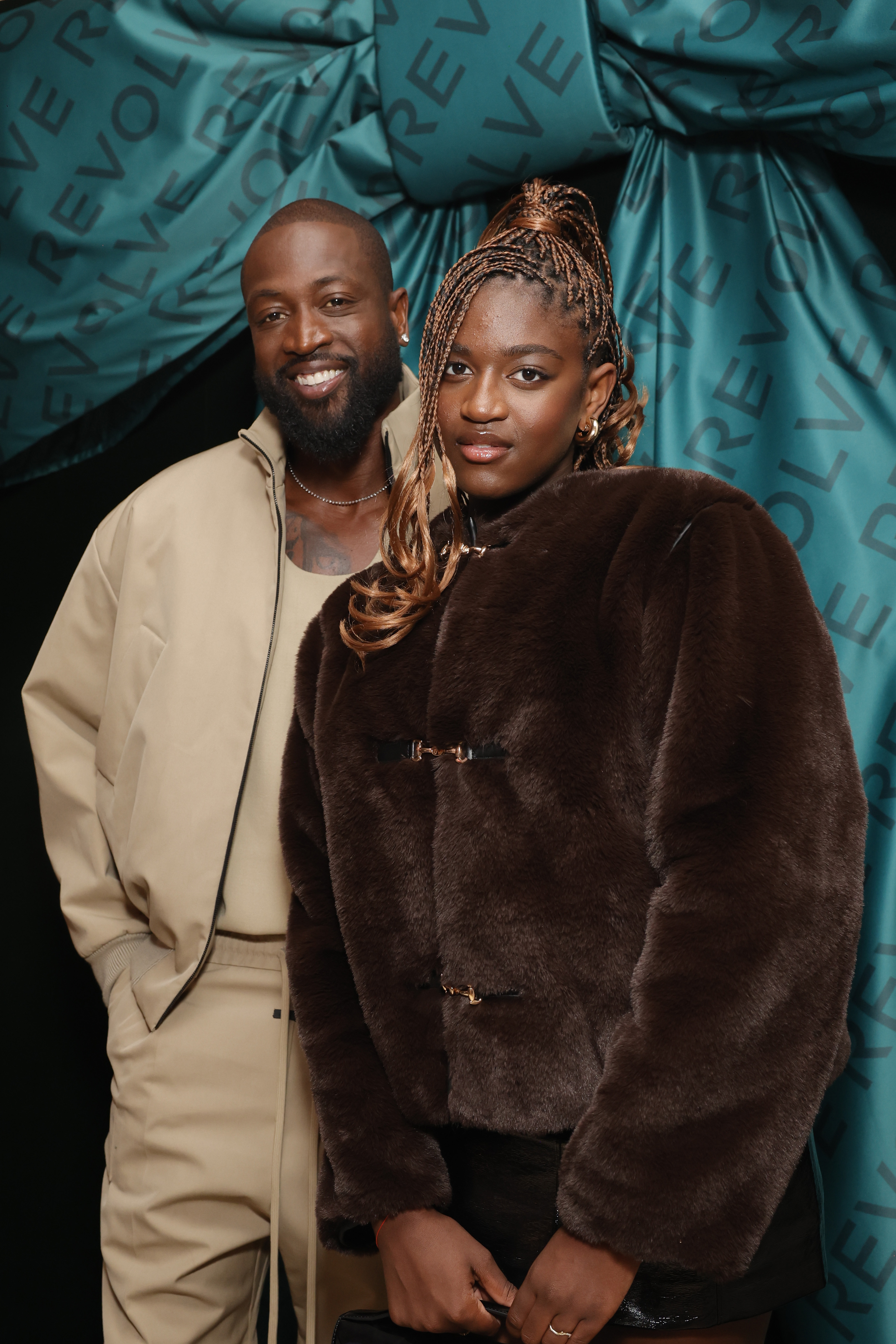 Dwyane and Zaya Wade attend Revolve's Holiday Shop Grand Opening on November 14, 2024 | Source: Getty Images