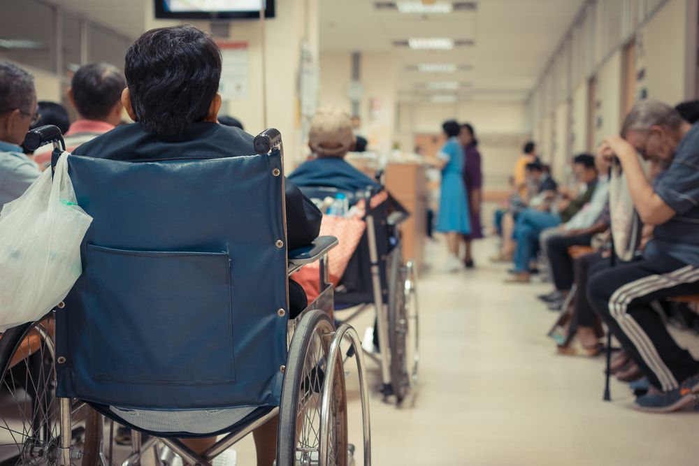 Several people lined up in the hospital. | Source: Shutterstock
