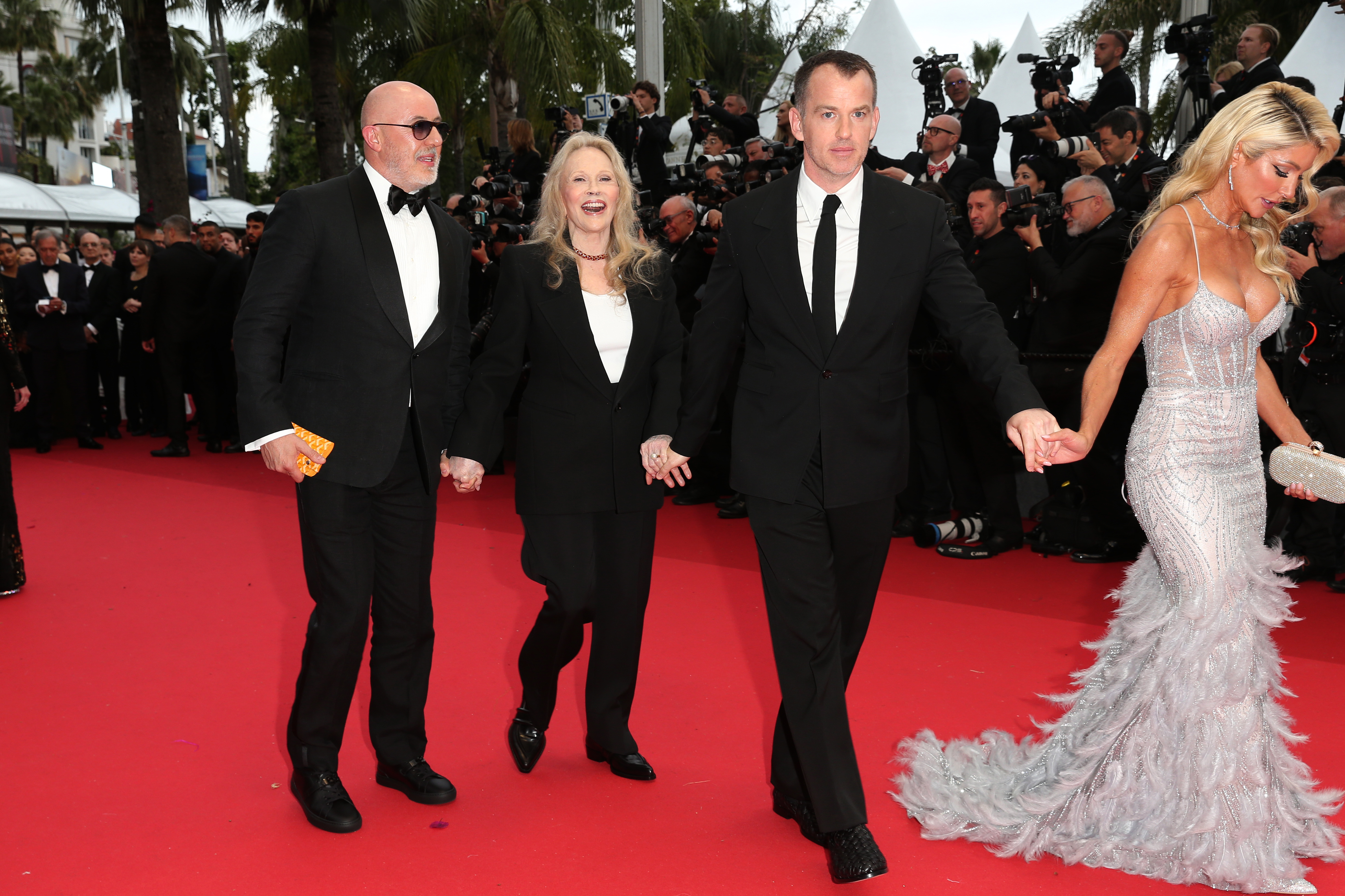 McKinzie Roth, the American actress and her son, Liam, and Laurent Bouzereau at the"Furiosa: A Mad Max Saga" (Furiosa: Une Saga Mad Max) Red Carpet at the 77th annual Cannes Film Festival at Palais des Festivals on May 15, 2024 in Cannes, France | Source: Getty Images