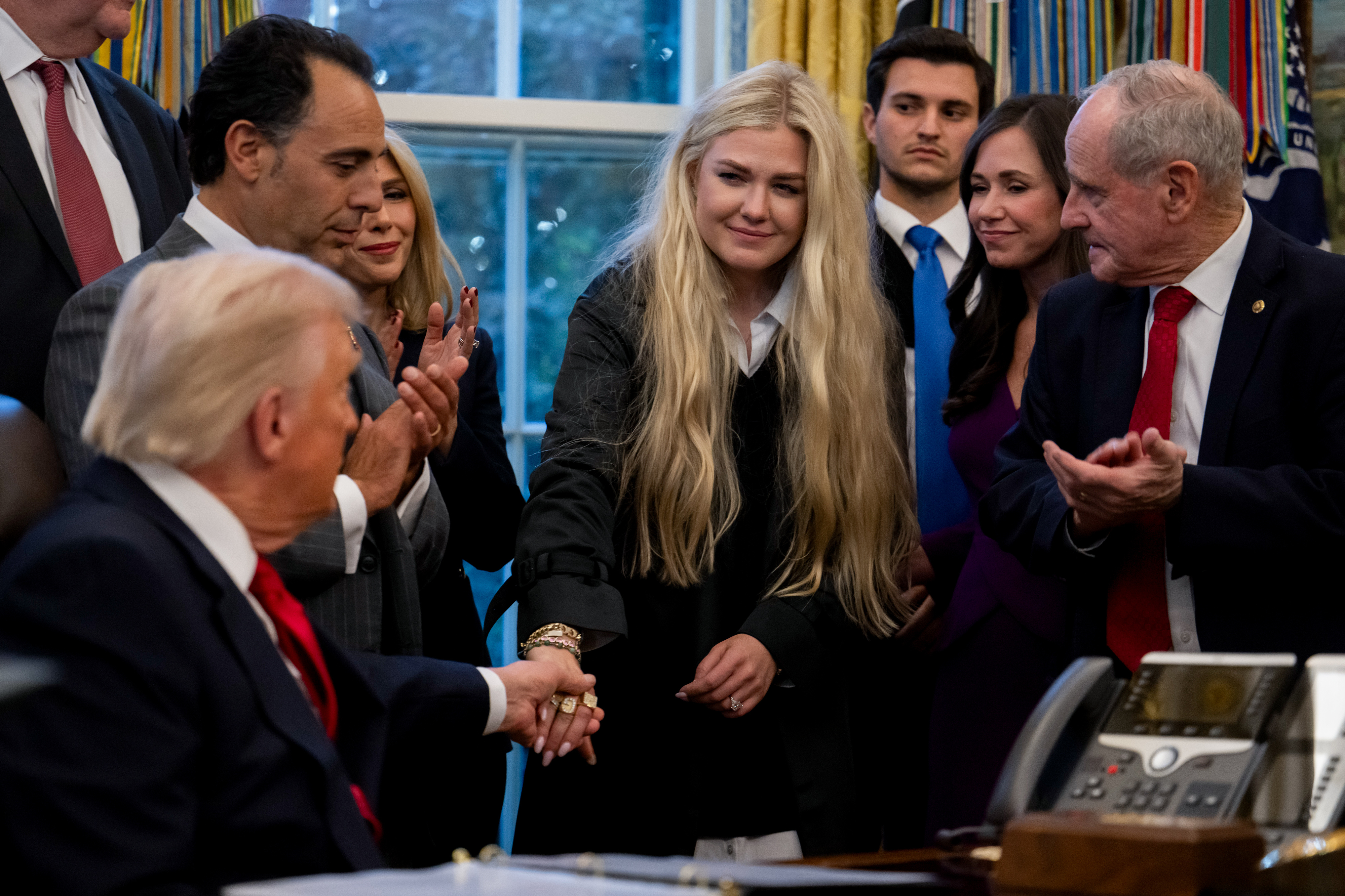 US President Donald Trump and Erika Kirk greet each other during the swearing-in ceremony of US Ambassador to India Sergio Gor in the Oval Office of the White House on November 10, 2025, in Washington, DC | Source: Getty Images
