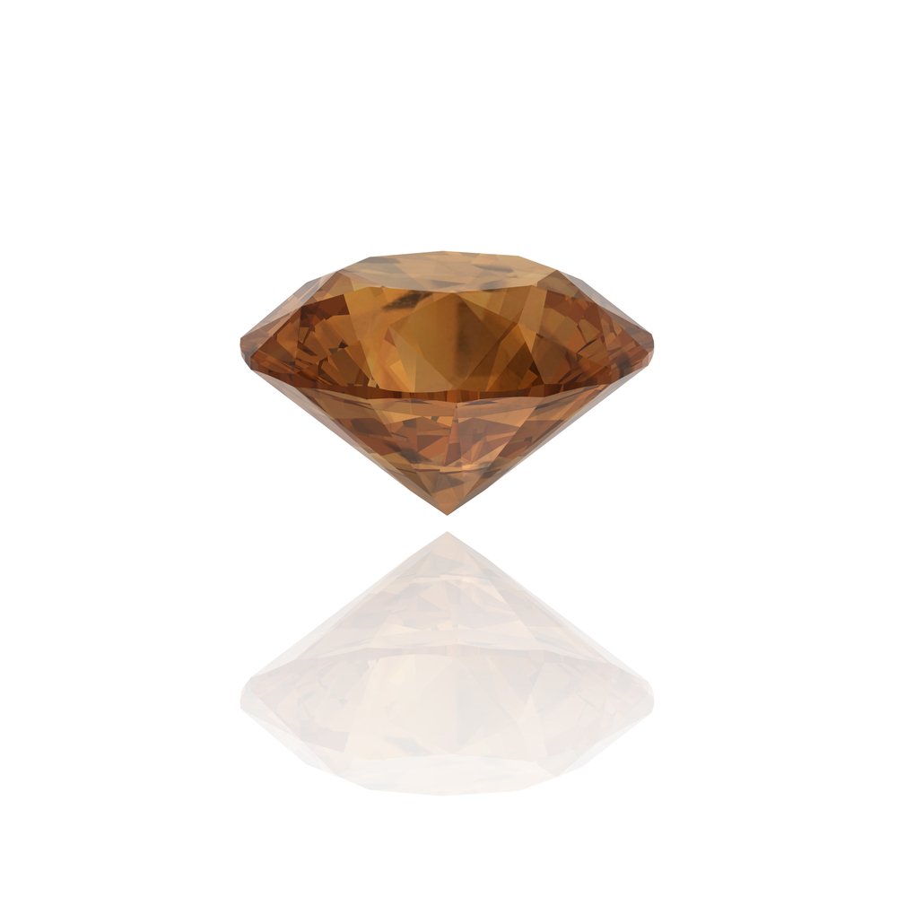 A photo of a brown diamond on white background. | Photo: Shutterstock.