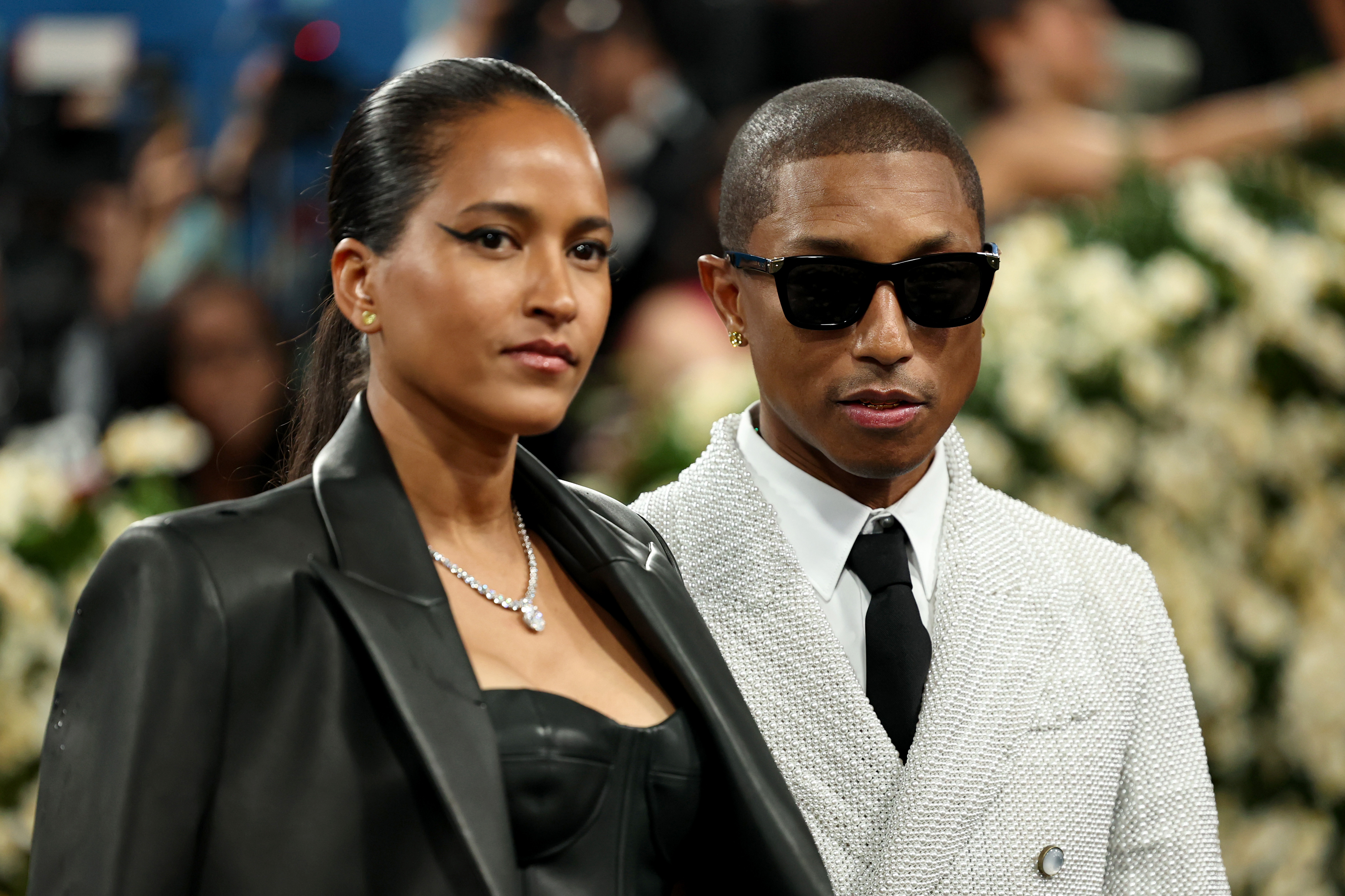 Helen Lasichanh and Pharrell Williams attend the Met Gala Celebrating "Superfine: Tailoring Black Style" on May 5, 2025, in New York City. | Source: Getty Images