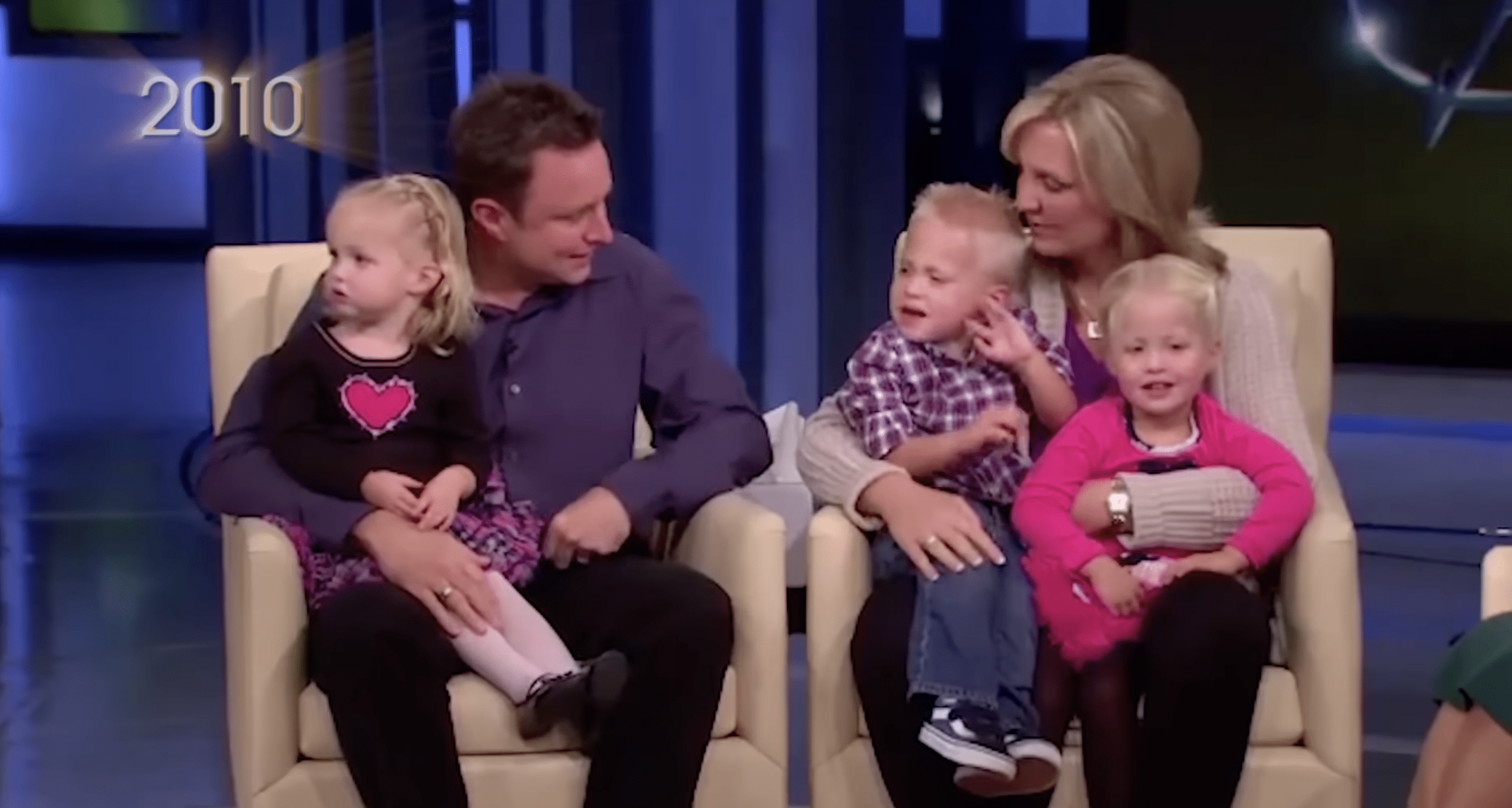 Chris and Lori Coble pictured with their triplets. | Photo: YouTube.com/OWN 