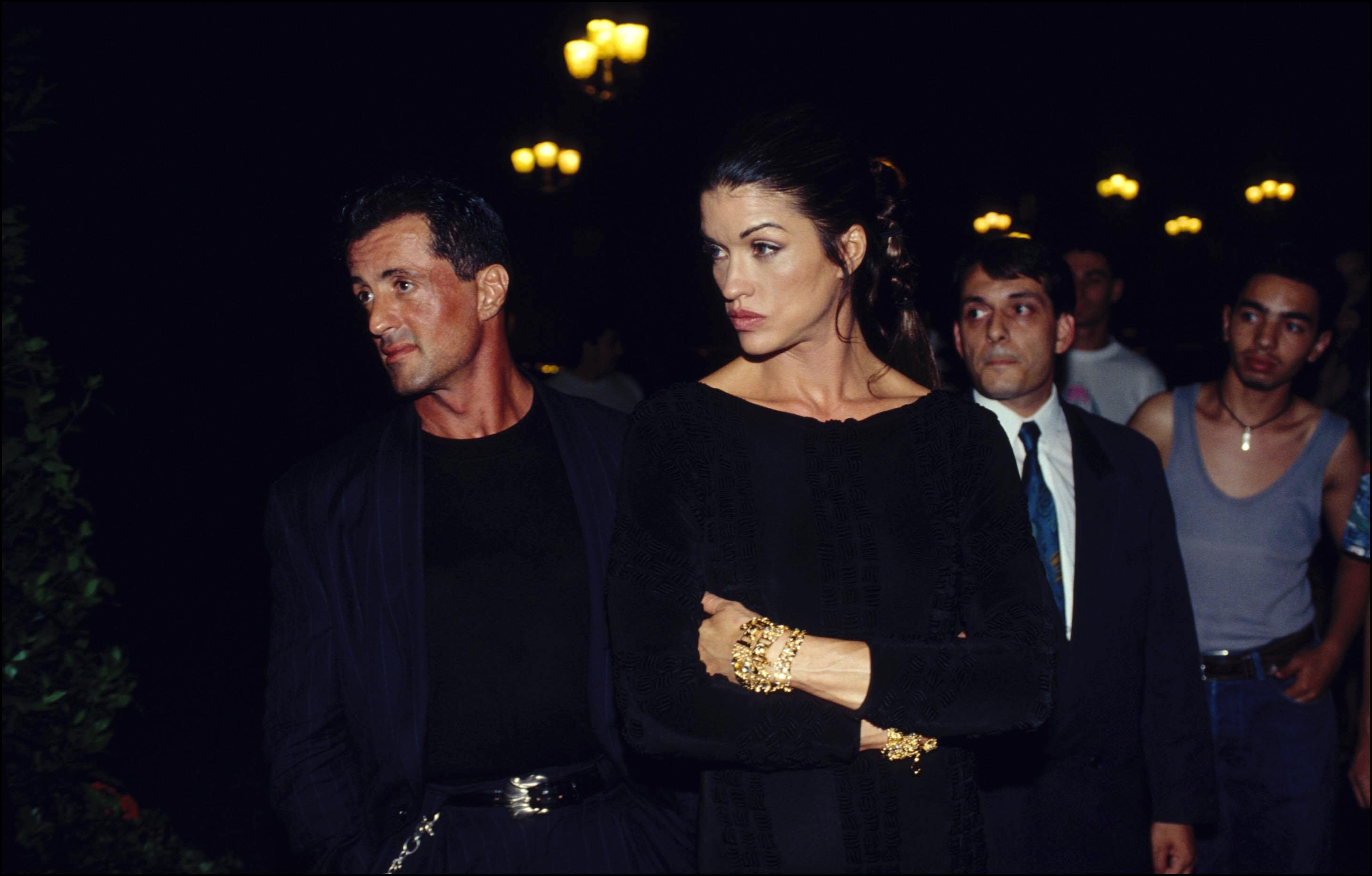 Sylvester Stallone and model Janice Dickinson attending Paris: Gianni Versace Fashion Show People on July 17, 1994. | Source: Getty Images
