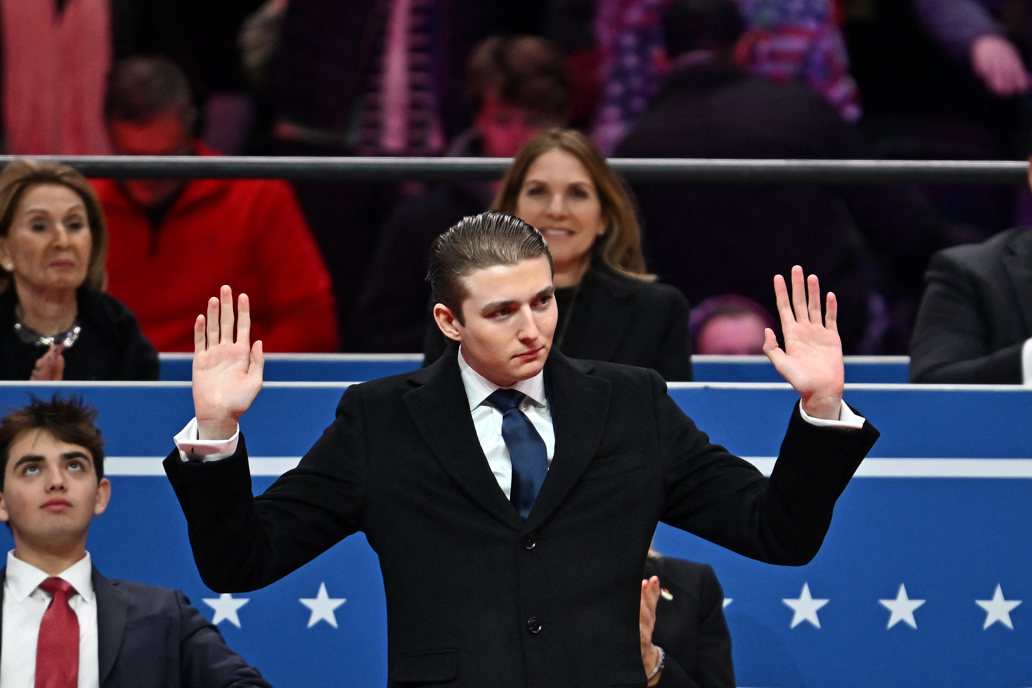 Barron Trump gestures after being acknowledged by his father President Donald Trump during the inaugural parade in Washington, DC, on January 20, 2025 | Source: Getty Images