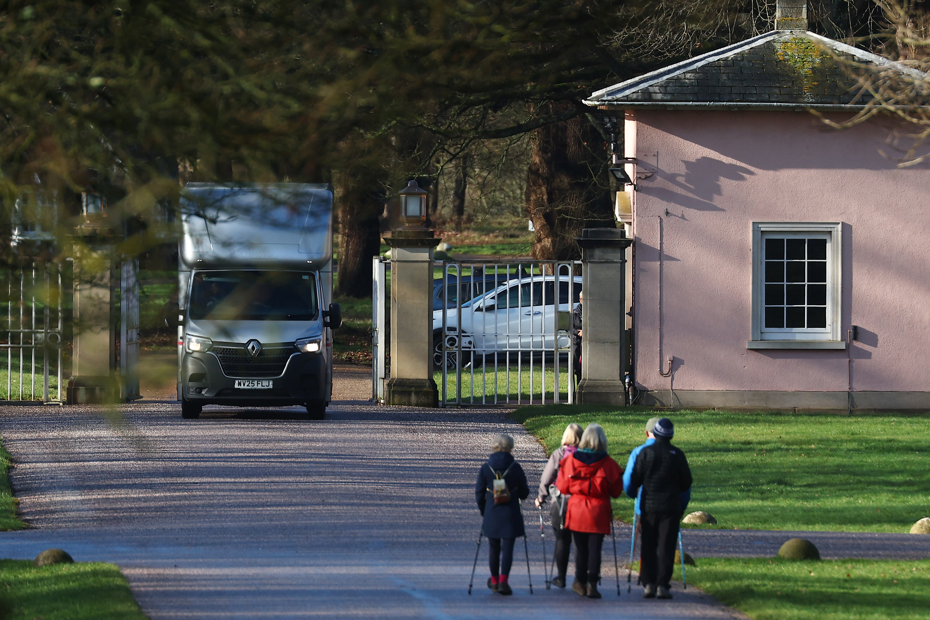 A removals vehicle passes through the gates of Royal Lodge, watched only by a handful of walkers in Windsor Great Park, as work gets underway to empty the property. The quiet daytime activity contrasted sharply with the former prince's late-night departure, reflecting efforts to normalise a transition that marked a decisive end to his residence at the prestigious royal estate.