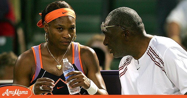 Serena Williams talks with her father Richard Williams after the first set against Nicole Vaidisova of the Czech Republic during their quarterfinals match on day eight at the 2007 Sony Ericsson Open at the Tennis Center at Crandon Park on March 28, 2007 in Miami, Florida. | Source: Getty Images
