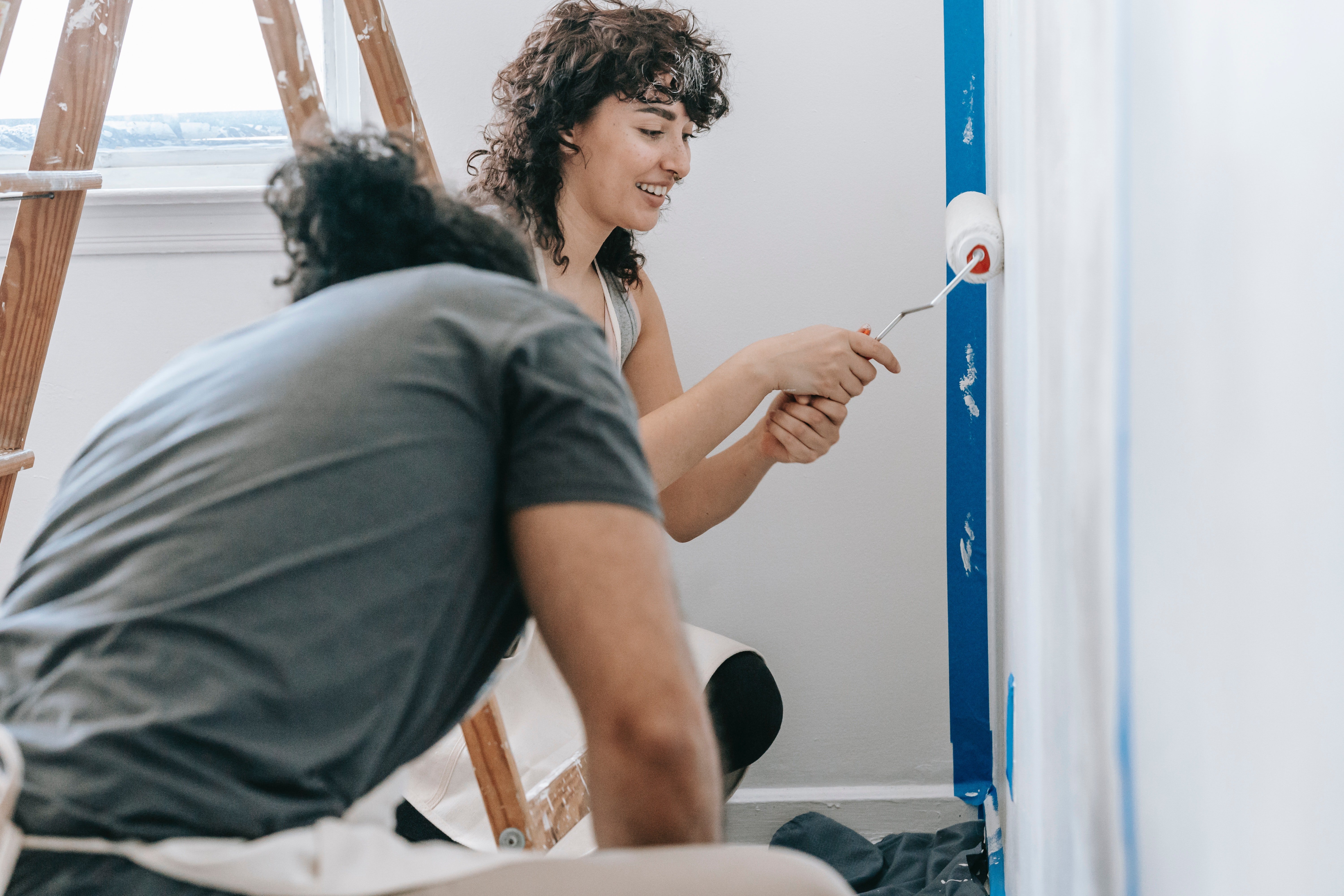 Pictured - A woman painting the wall | Source: Pexels