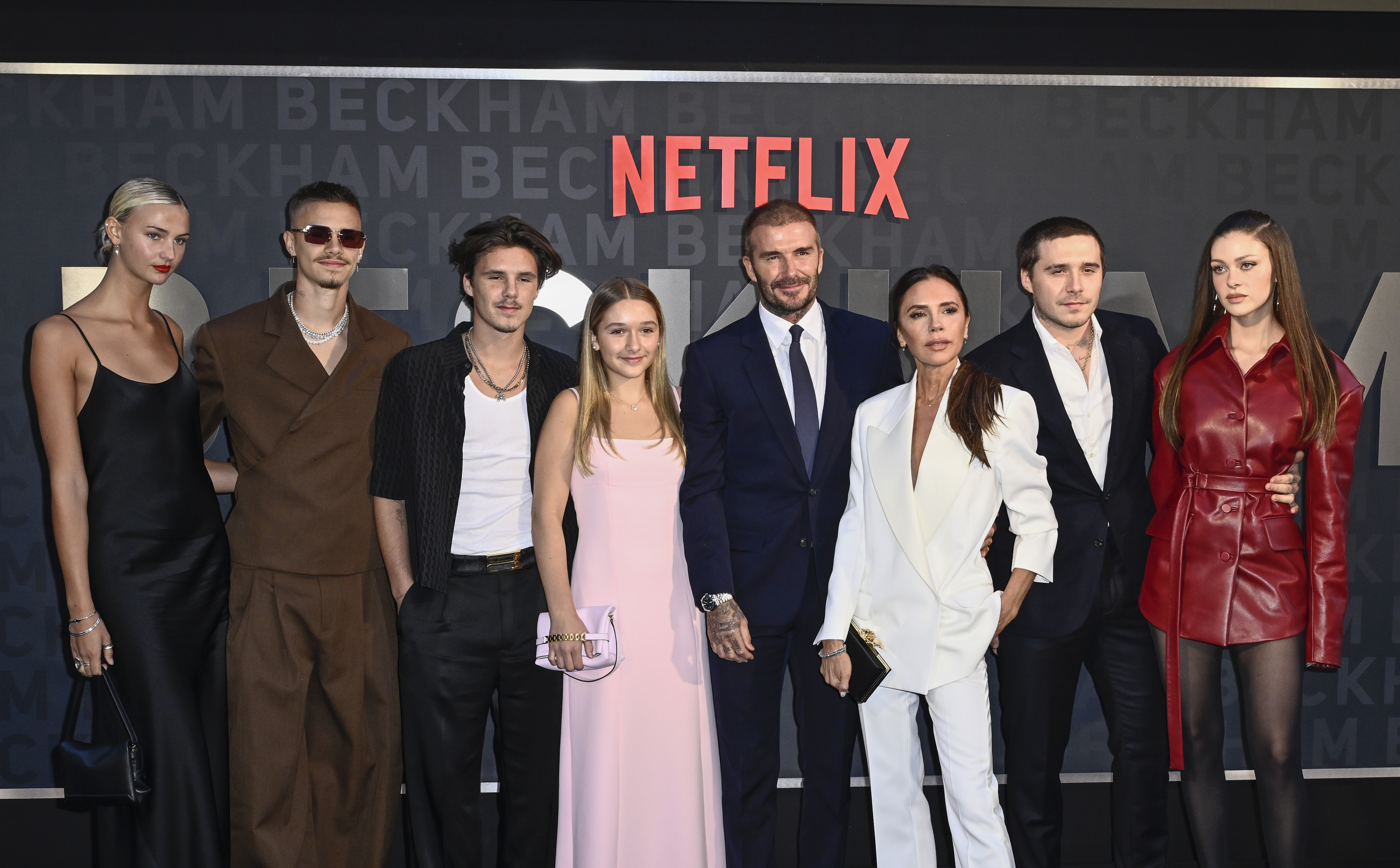 Mia Regan, Romeo Beckham, Cruz Beckham, Harper Beckham, David Beckham, Victoria Beckham, Brooklyn Peltz Beckham and Nicola Peltz Beckham attend the Netflix 'Beckham' UK Premiere at The Curzon Mayfair on 3 October 2023 in London, England. | Source: Getty Images