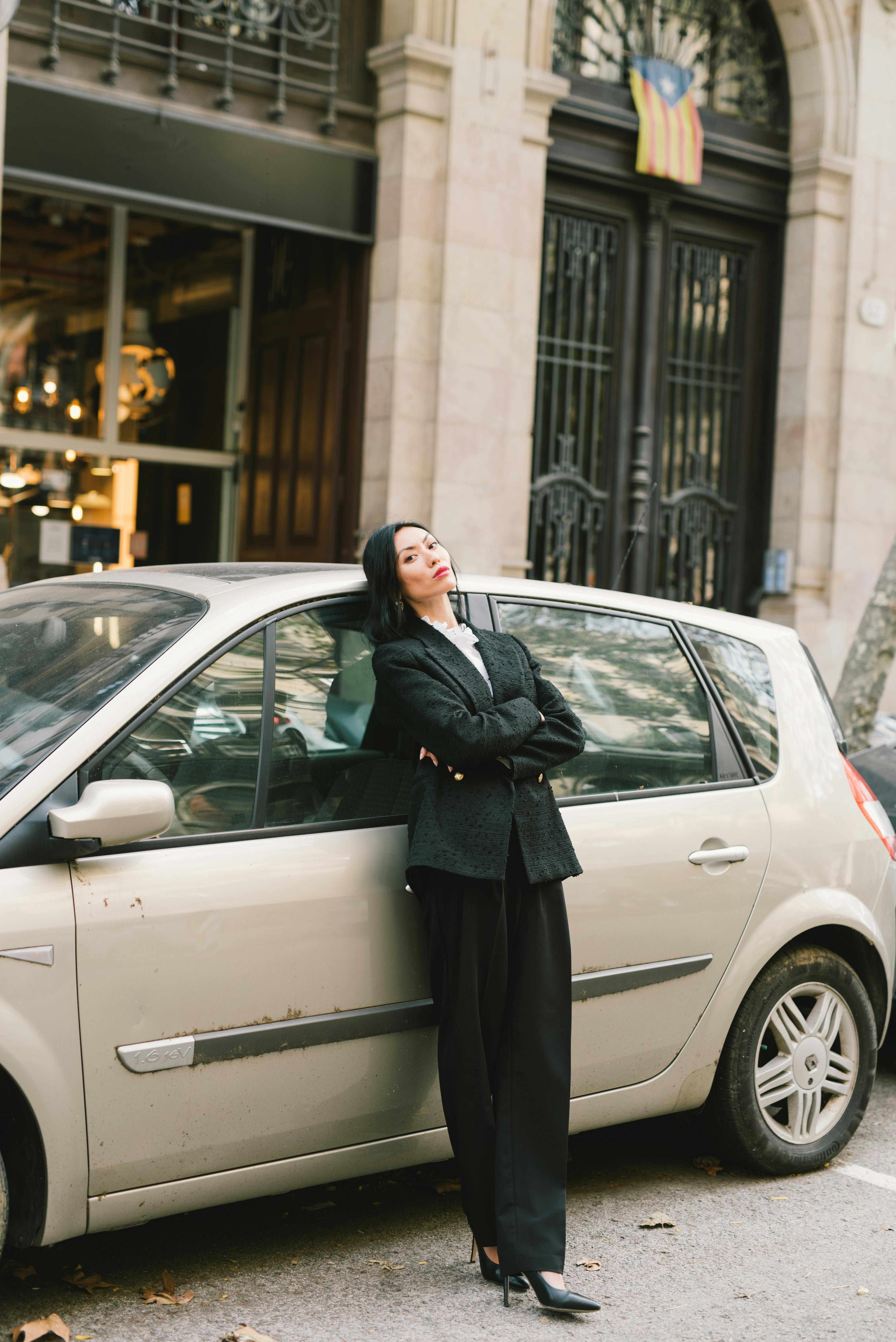 A woman standing by a car | Source: Pexels