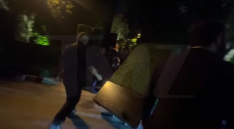 The faux hedges for Kris Jenner's 70th birthday party being moved out of the street. | Source: Instagram/tmz_tv