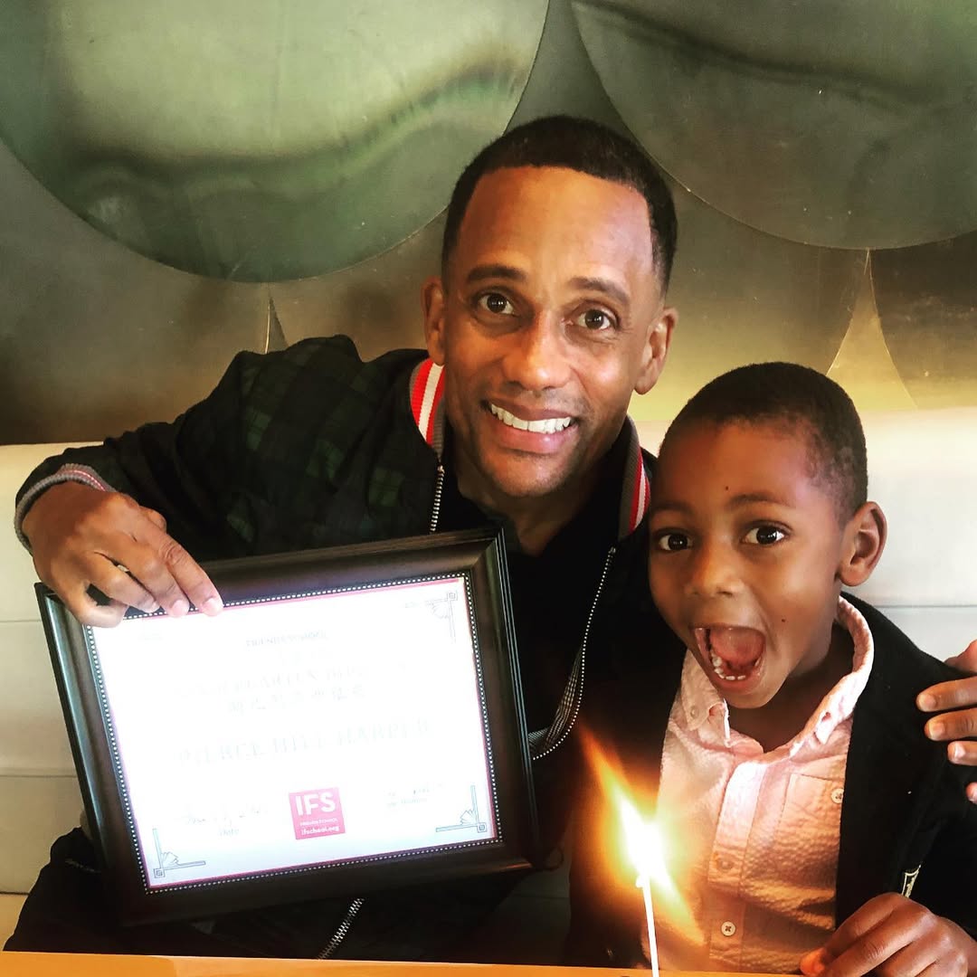 The TV star celebrating a special moment with his son Pierce in a post dated June 20, 2021 | Source: Instagram/hillharper