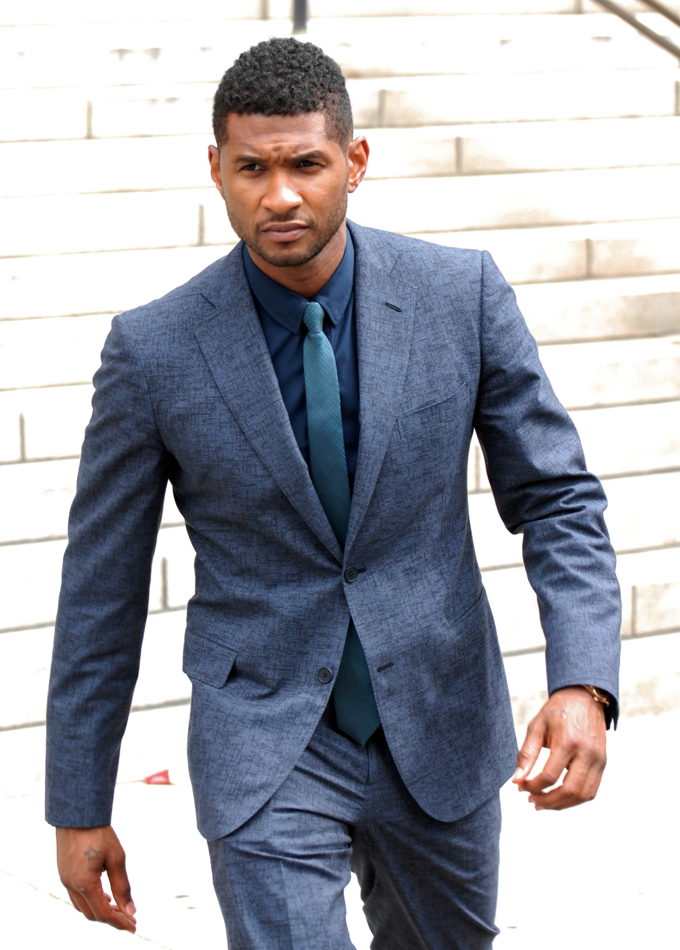 Usher Raymond attends a child custody meeting at Fulton County State Court on August 15, 2012 | Source: Getty Images