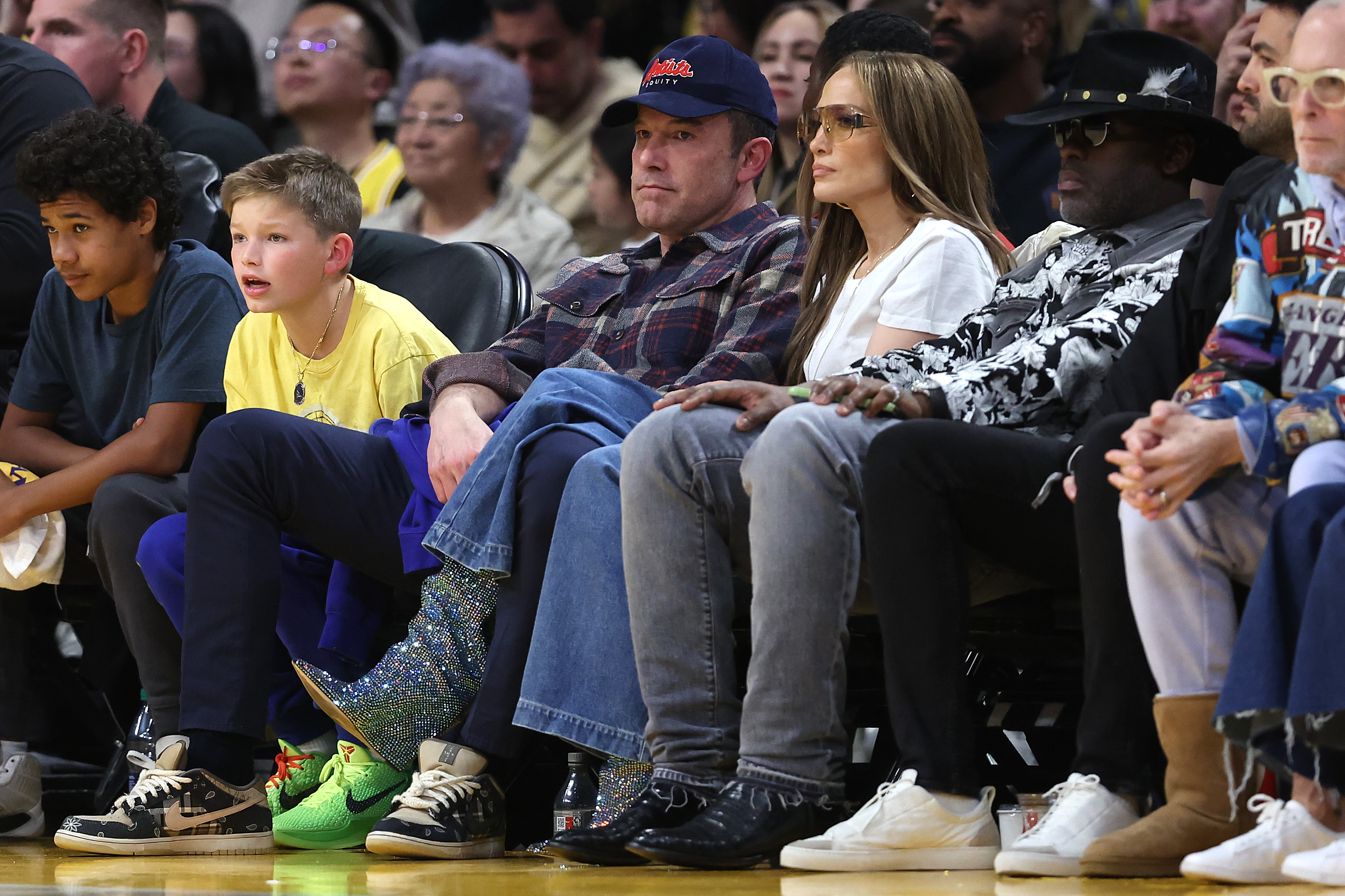 Jennifer Lopez, Ben Affleck, and Samuel Garner Affleck at a Los Angeles Lakers and Golden State Warriors basketball game on March 16, 2024 | Source: Getty Images