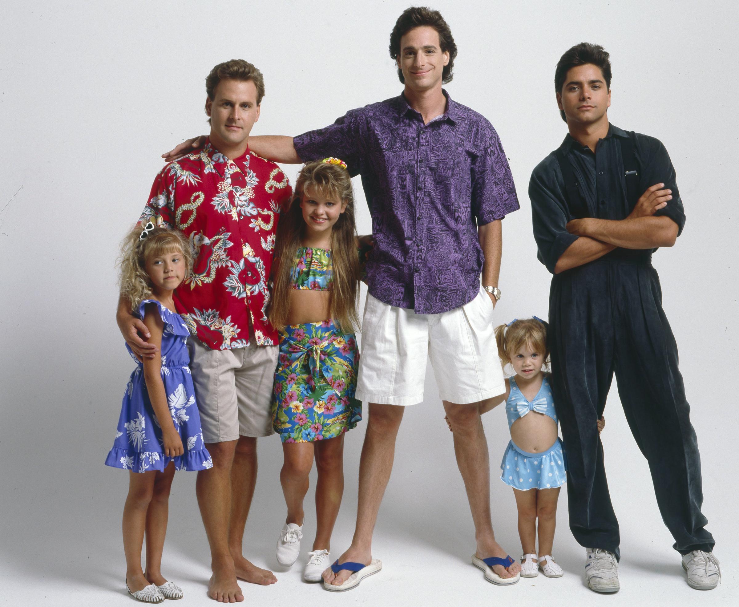 Jodie Sweetin, Dave Coulier, Candace Cameron, Bob Saget, Mary-Kate, Ashley Olsen, John Stamos in 1989 | Source: Getty Images
