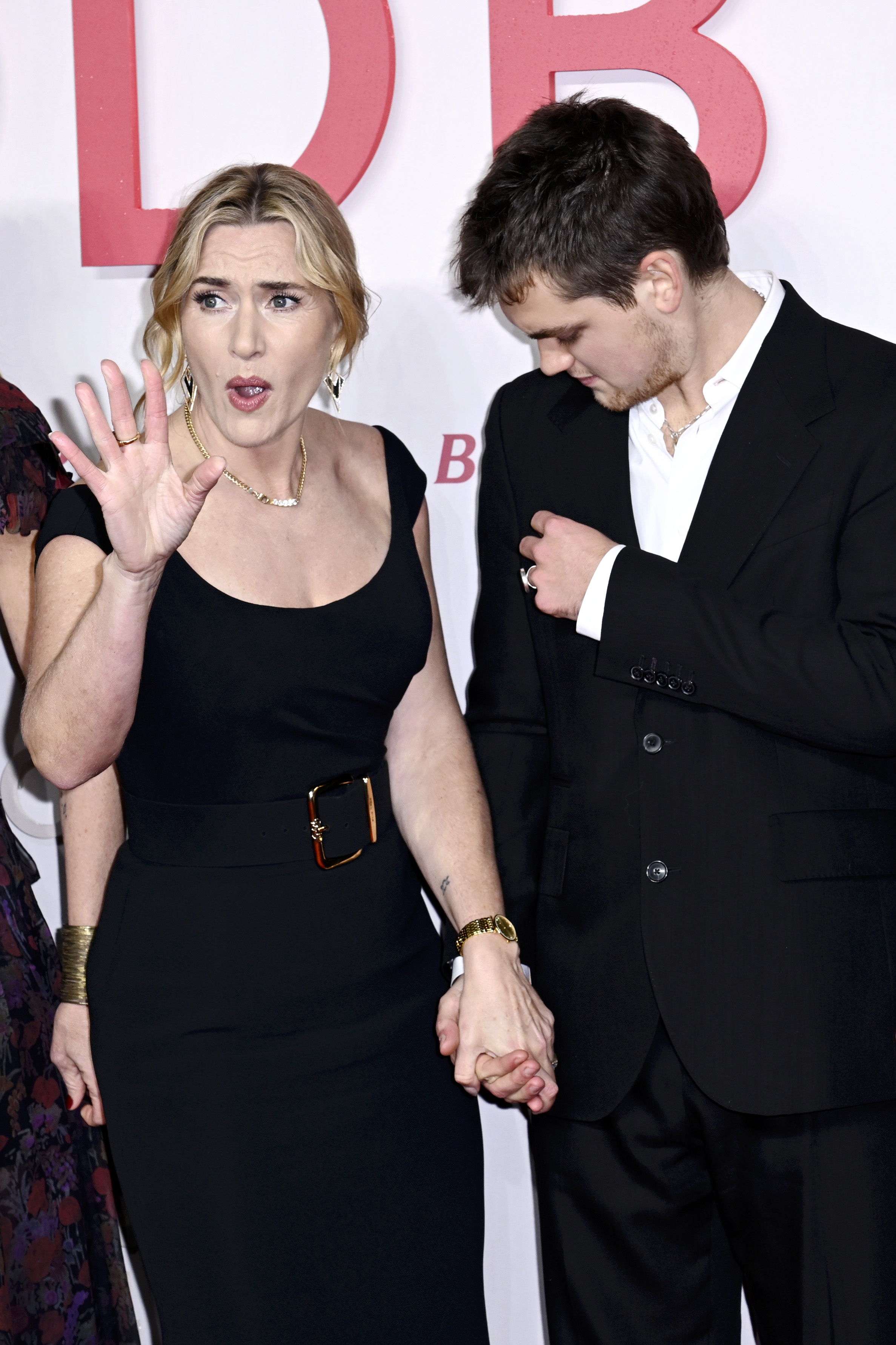 Captured in a candid exchange, Winslet animatedly gestured toward the crowd as she held onto Anders's hand — a gesture of support that underscored the intimacy of the night. The 21-year-old, who kept his gaze lowered in the moment, stood quietly by as his mother engaged with the press, showing a glimpse of the dynamic between the veteran actress and her emerging filmmaker son.
