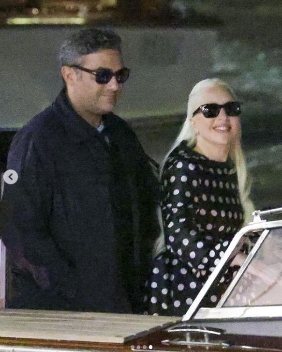 Lady Gaga and Michael Polansky on a boat during the 81st Venice International Film Festival on September 2, 2024, in Venice, Italy | Source: Instagram/justjared