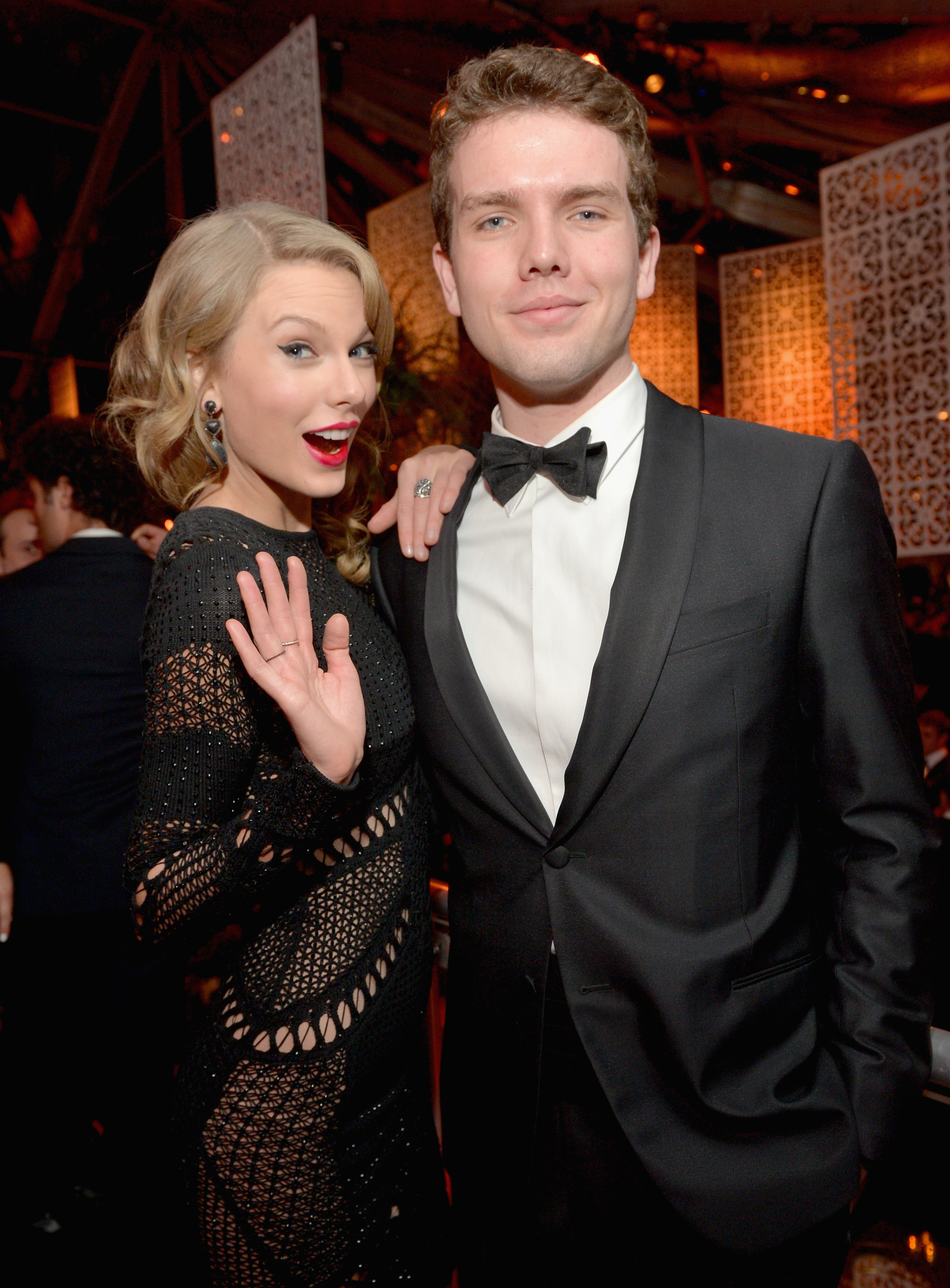 Taylor Swift is pictured with her brother, Austin Swift, at the 2014 Golden Globe Awards after-party in Beverly Hills. According to Bloomberg, Austin stood beside his sister as her man of honor instead of the couple having a traditional bridal party. | Source: Getty Images