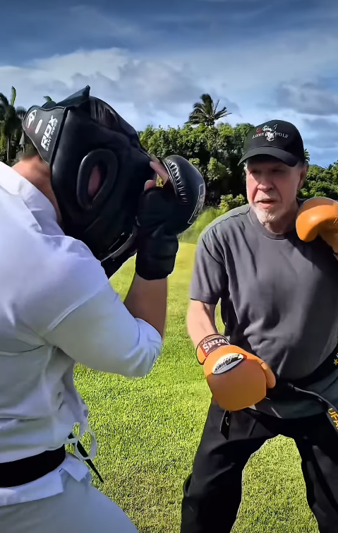 Chuck Norris trains with a sparring partner during a boxing session | Source: Instagram/chucknorris